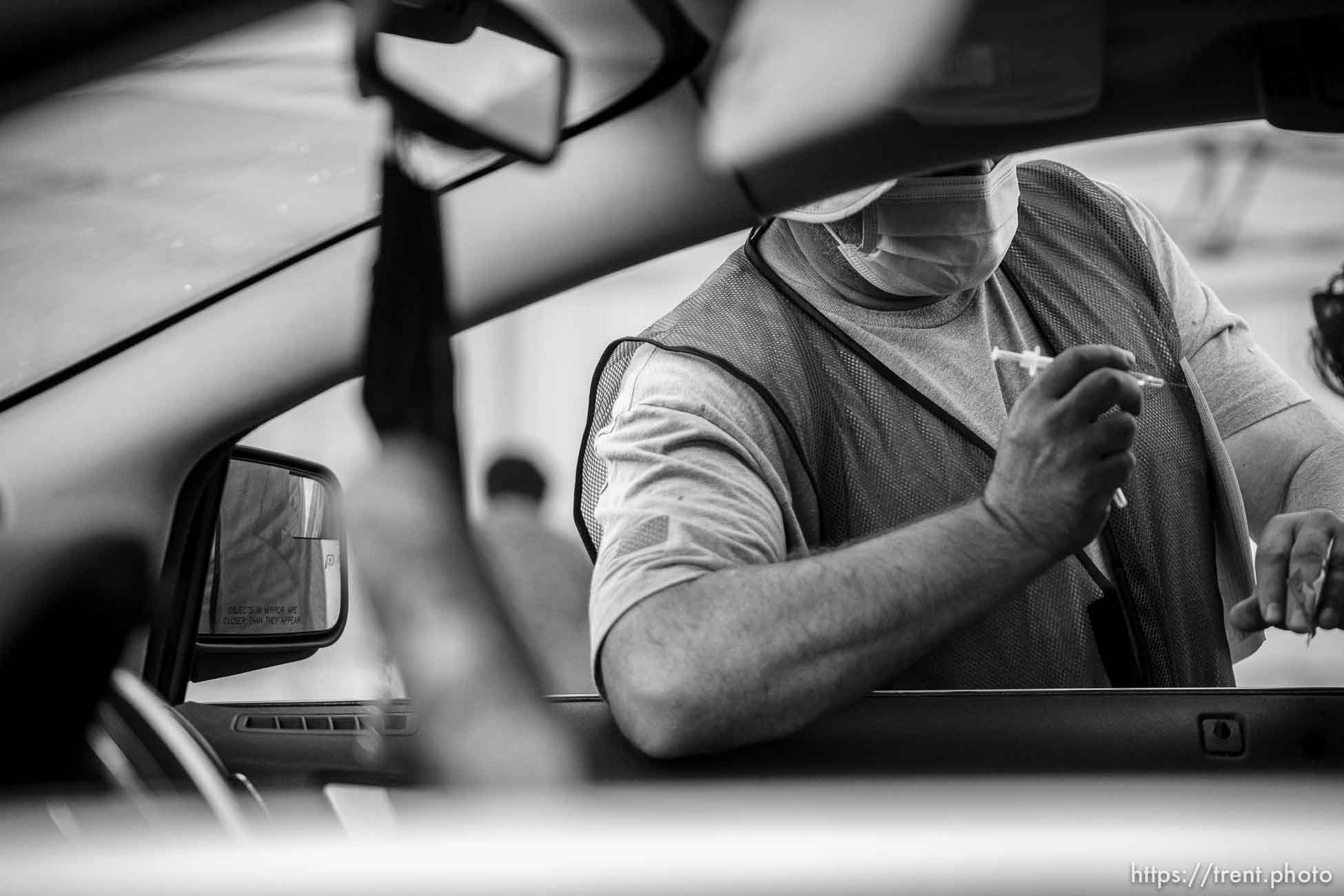 (Trent Nelson  |  The Salt Lake Tribune) Shane Carter administers a dose of the Pfizer COVID-19 vaccine at a drive-thru event organized by the Utah County Health Department in Spanish Fork on Friday, Sept. 10, 2021.