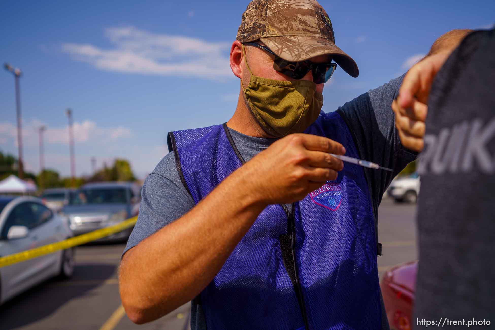 (Trent Nelson  |  The Salt Lake Tribune) Colton Shakespear administers a dose of the Pfizer COVID-19 vaccine at a drive-thru event organized by the Utah County Health Department in Spanish Fork on Friday, Sept. 10, 2021.