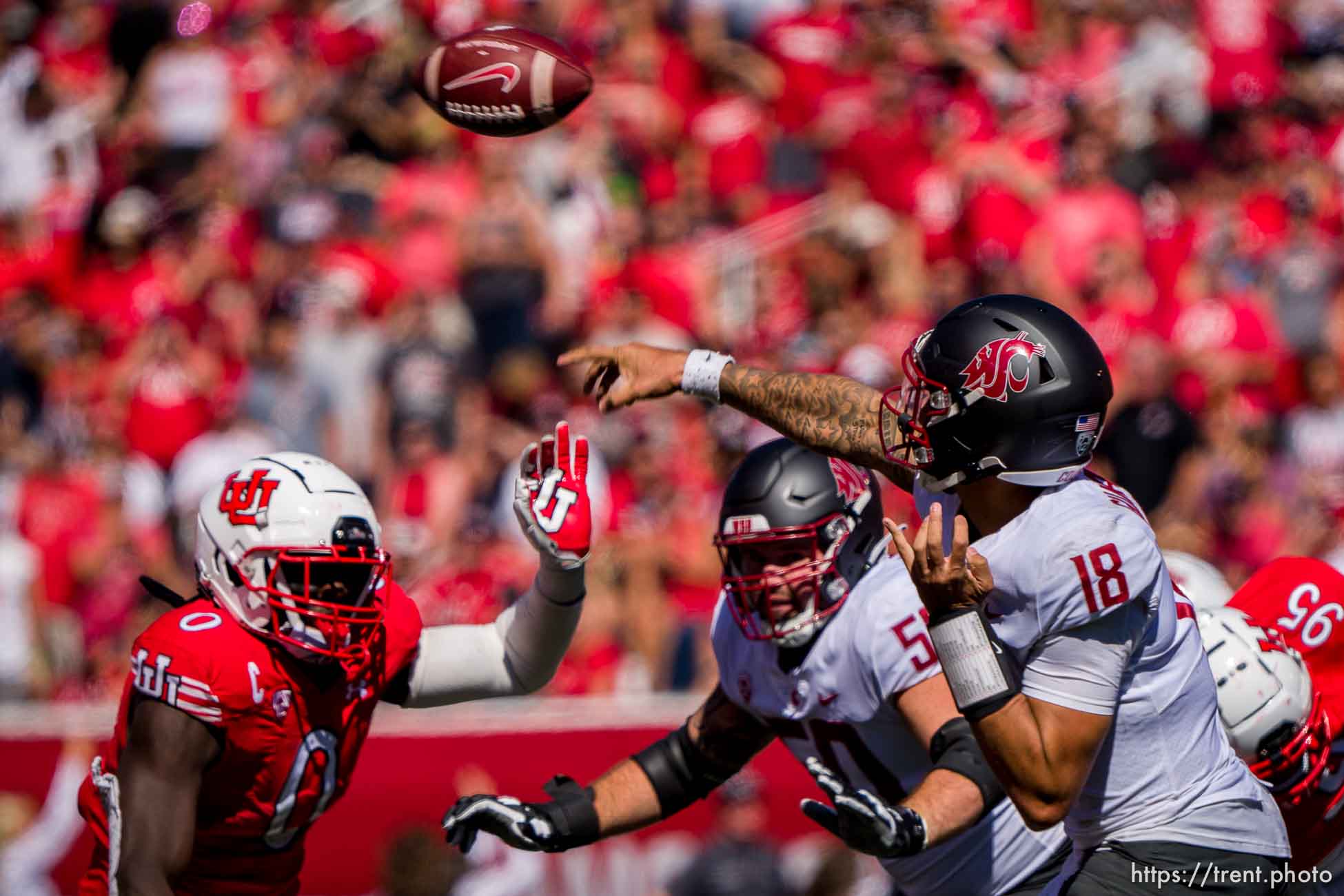 (Trent Nelson  |  The Salt Lake Tribune) Washington State Cougars quarterback Jarrett Guarantano (18) passes over Utah Utes linebacker Devin Lloyd (0) as the University of Utah hosts Washington State, NCAA football in Salt Lake City on Saturday, Sept. 25, 2021.