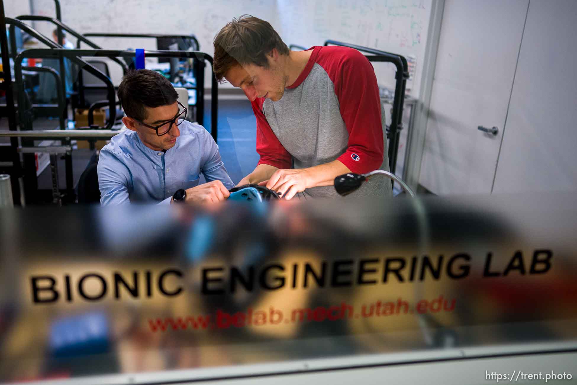 (Trent Nelson  |  The Salt Lake Tribune) Tommaso Lenzi and Marshall Ishmael work on an exoskeleton to assist leg amputees at the University of Utah on Wednesday, Oct. 13, 2021.