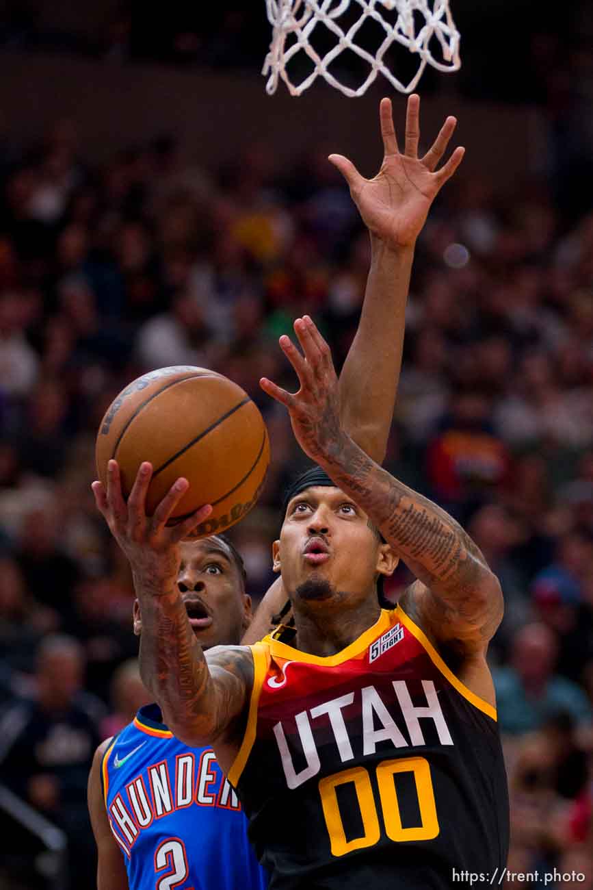 (Trent Nelson  |  The Salt Lake Tribune) Utah Jazz guard Jordan Clarkson (00) and Oklahoma City Thunder guard Shai Gilgeous-Alexander (2) as the Utah Jazz host the Oklahoma City Thunder, NBA basketball in Salt Lake City on Wednesday, Oct. 20, 2021.