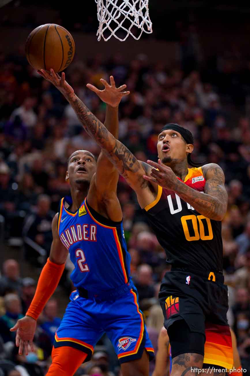 (Trent Nelson  |  The Salt Lake Tribune) Utah Jazz guard Jordan Clarkson (00) shoots, defended by Oklahoma City Thunder guard Shai Gilgeous-Alexander (2) as the Utah Jazz host the Oklahoma City Thunder, NBA basketball in Salt Lake City on Wednesday, Oct. 20, 2021.