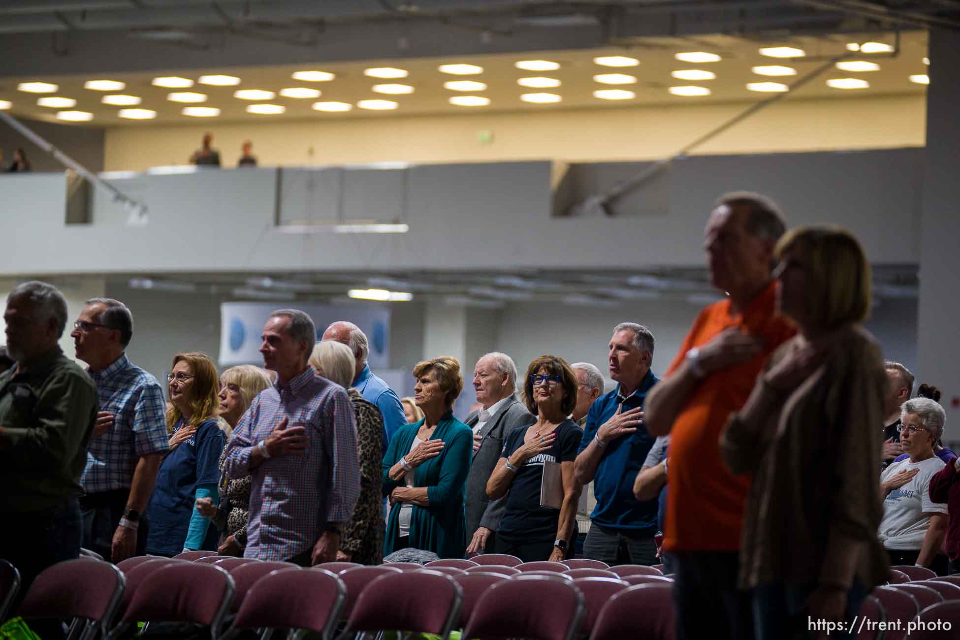 (Trent Nelson  |  The Salt Lake Tribune) Attendees stand for the National Anthem at the WeCANact Liberty Conference, held at the Salt Palace Convention Center in Salt Lake City on Friday, Oct. 22, 2021.