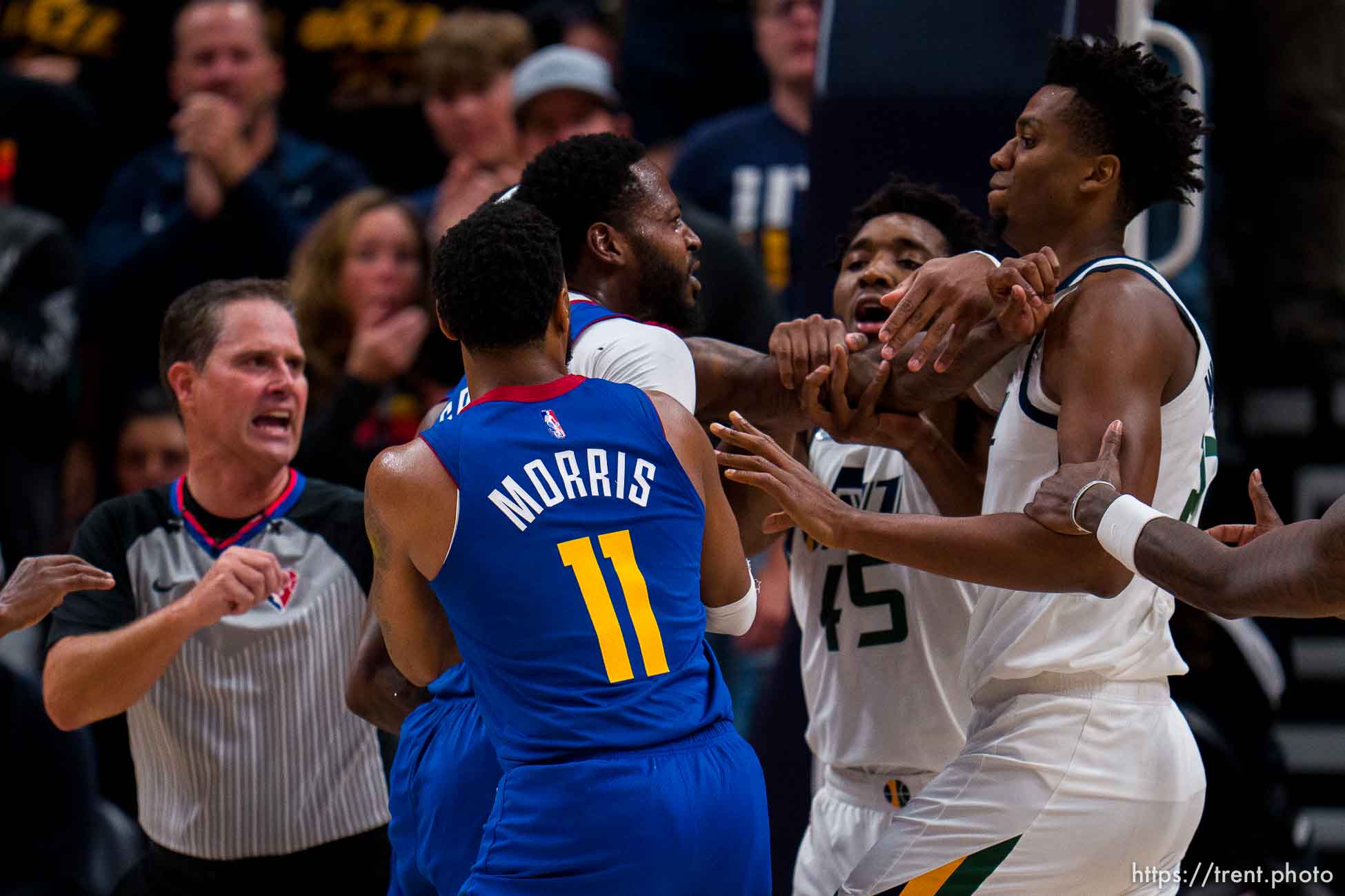 (Trent Nelson  |  The Salt Lake Tribune) Denver Nuggets forward JaMychal Green (0) and Utah Jazz center Hassan Whiteside (21) confront each other before both being ejected as the Utah Jazz host the Denver Nuggets, NBA basketball in Salt Lake City on Tuesday, Oct. 26, 2021.