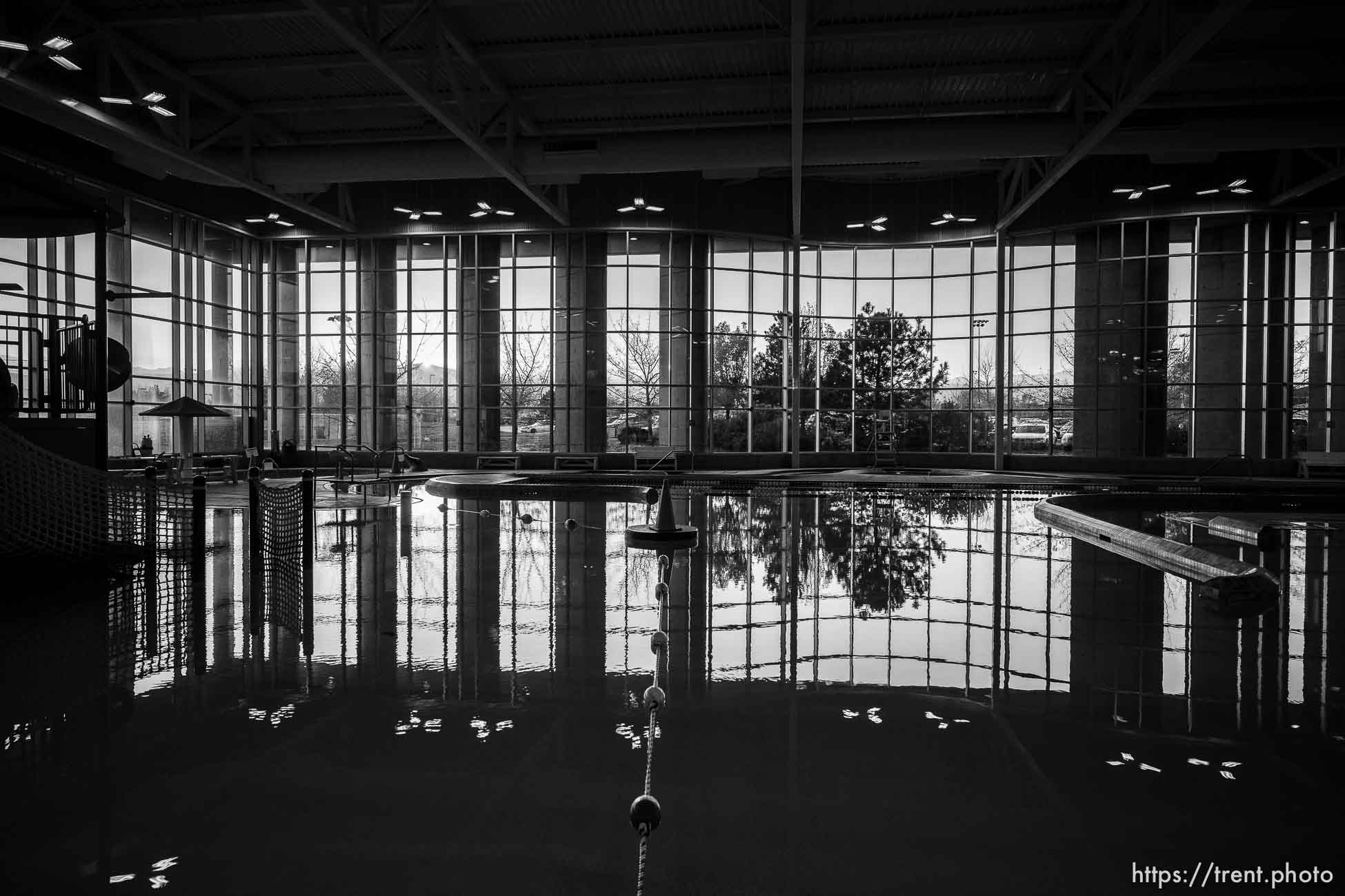 (Trent Nelson  |  The Salt Lake Tribune) The sun sets through the windows of the pool at the South Jordan Fitness & Aquatics Center on Wednesday, Nov. 3, 2021.