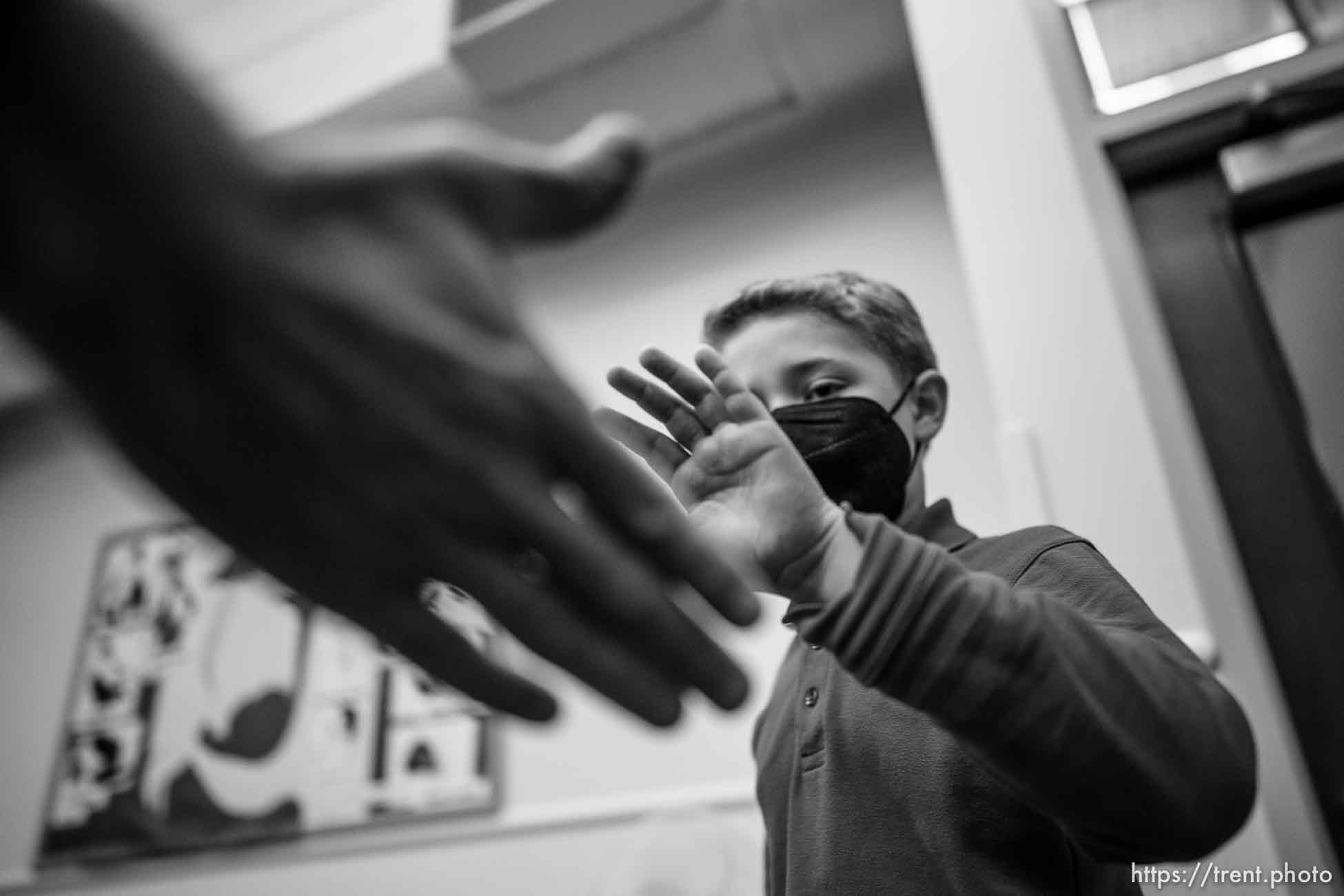 (Trent Nelson  |  The Salt Lake Tribune) Ryan Woodbury high-fives his father Tom after he was vaccinated against COVID-19 by Tenzin Drongsar at South Main Public Health Center in South Salt Lake on Wednesday, Nov. 3, 2021.