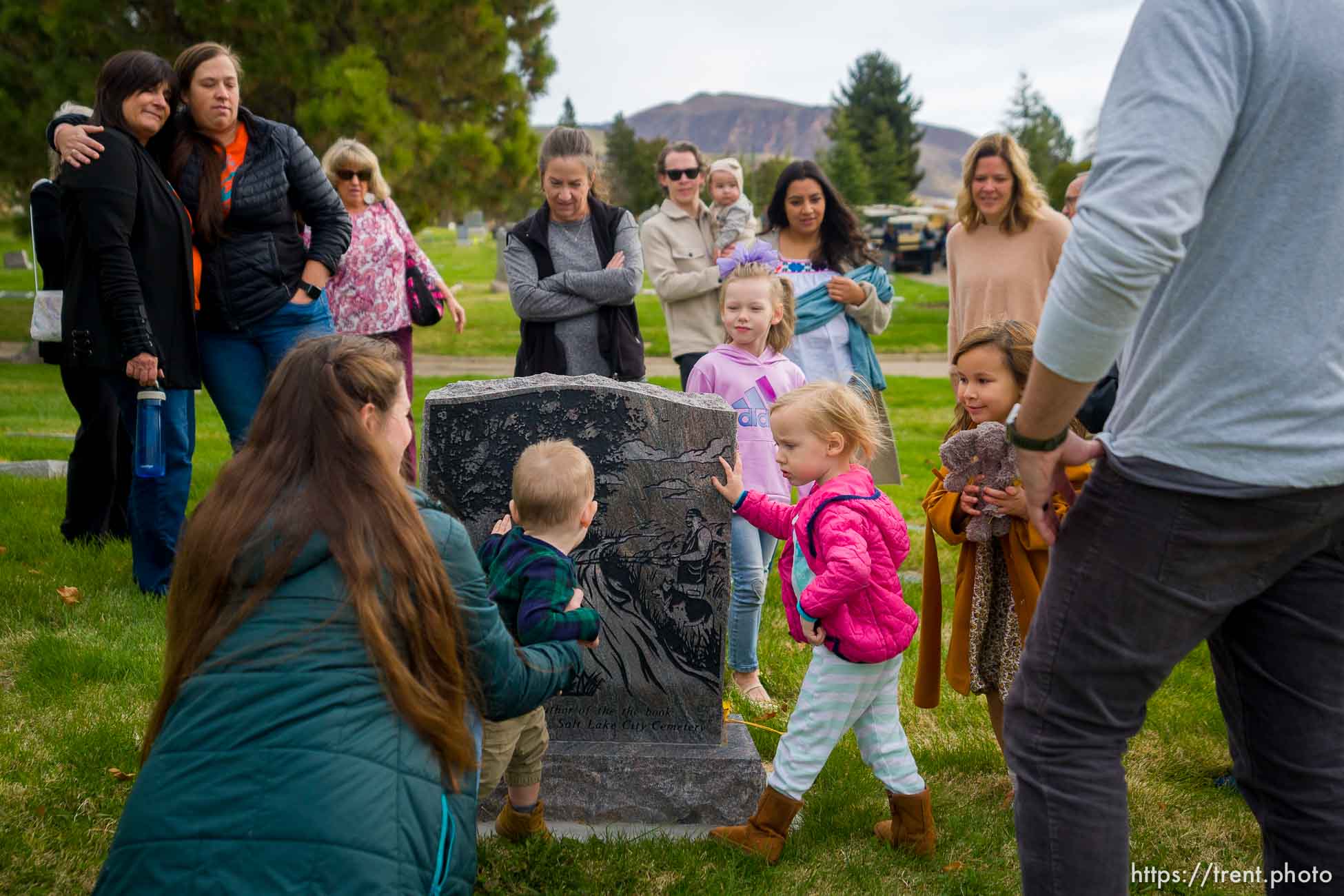 (Trent Nelson  |  The Salt Lake Tribune) Family and friends of Mark Smith, former sexton of Salt Lake City Cemetery, gather at his grave as Salt Lake City announces the newly accredited Mark Smith Memorial Arboretum at Salt Lake City Cemetery on Saturday, Nov. 6, 2021.