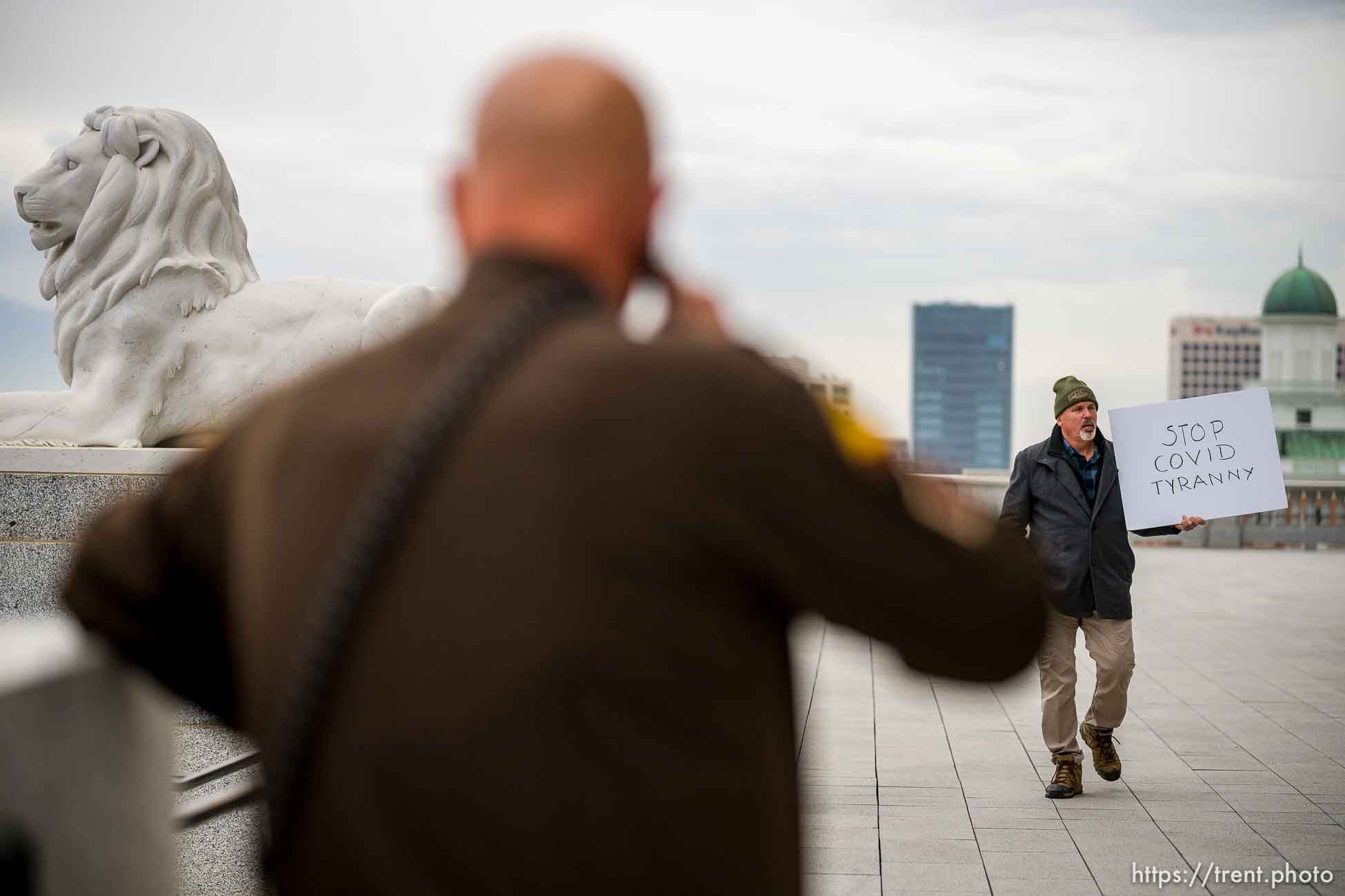 (Trent Nelson  |  The Salt Lake Tribune) A protester against COVID-19 mask and vaccination mandates walks the State Capitol grounds as the Utah Legislature hold a special session in Salt Lake City on Tuesday, Nov. 9, 2021.