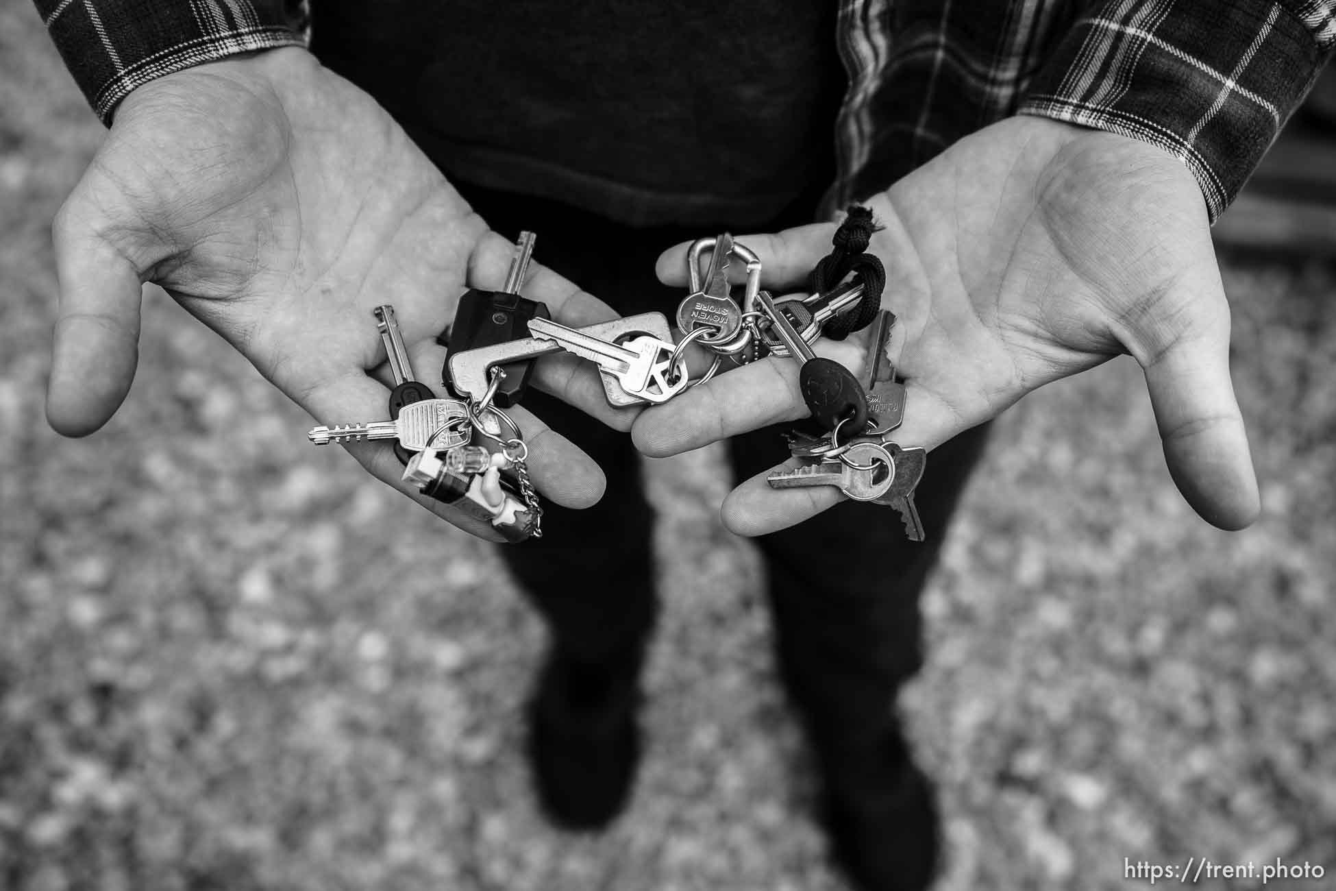 (Trent Nelson  |  The Salt Lake Tribune) John Warnock shows the many keys to locks securing his bikes, in Salt Lake City on Thursday, Nov. 11, 2021.