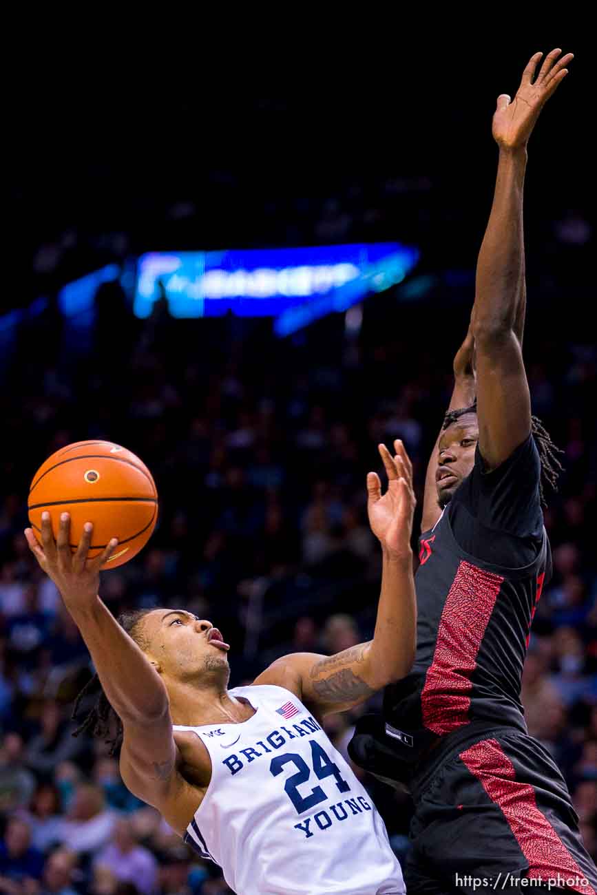 (Trent Nelson  |  The Salt Lake Tribune) Brigham Young Cougars forward Seneca Knight (24) San Diego State Aztecs forward Nathan Mensah (31) as BYU hosts San Diego State, NCAA basketball in Provo on Friday, Nov. 12, 2021.