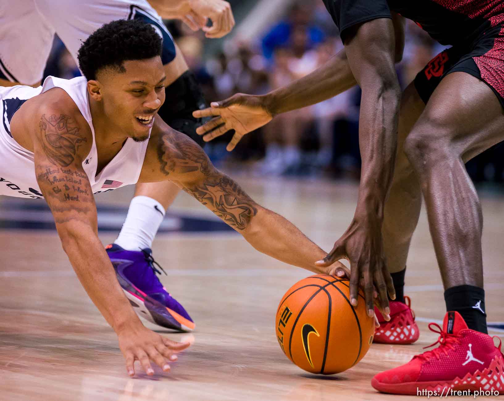 (Trent Nelson  |  The Salt Lake Tribune) Brigham Young Cougars guard Te'Jon Lucas (3) and San Diego State Aztecs forward Nathan Mensah (31) as BYU hosts San Diego State, NCAA basketball in Provo on Friday, Nov. 12, 2021.