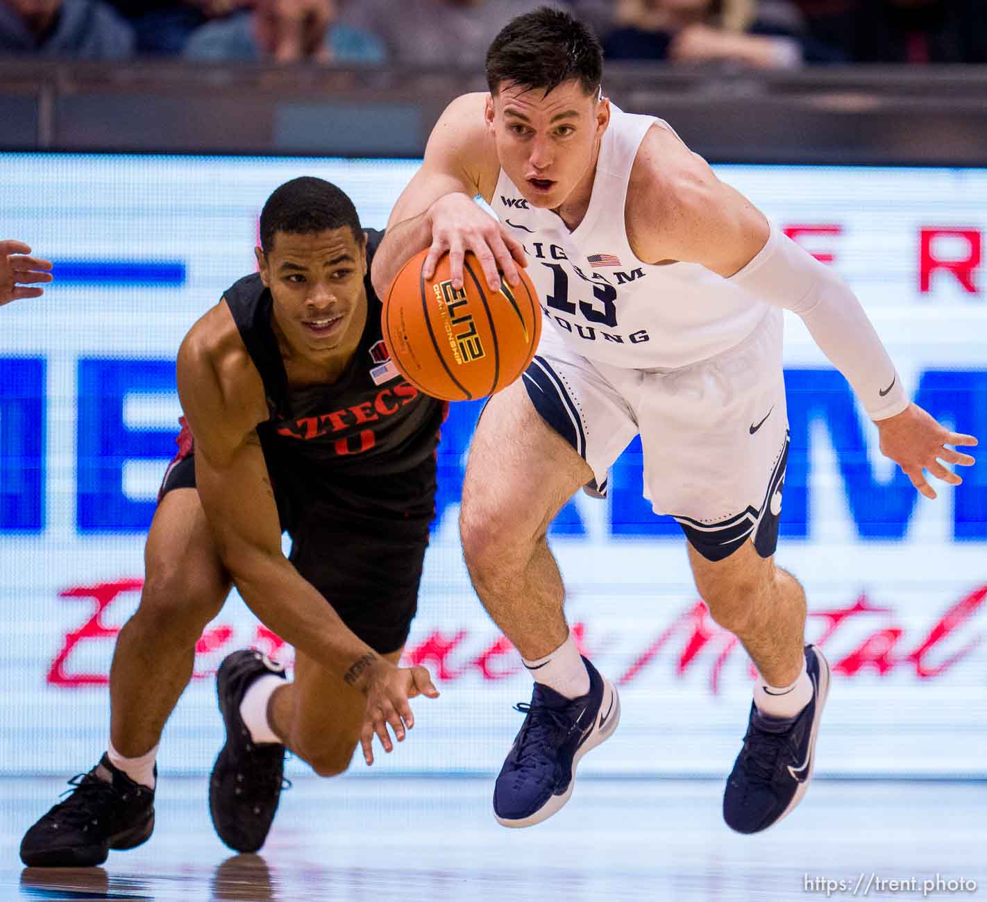 (Trent Nelson  |  The Salt Lake Tribune) Brigham Young Cougars guard Alex Barcello (13) steals the ball from San Diego State Aztecs forward Keshad Johnson (0) as BYU hosts San Diego State, NCAA basketball in Provo on Friday, Nov. 12, 2021.