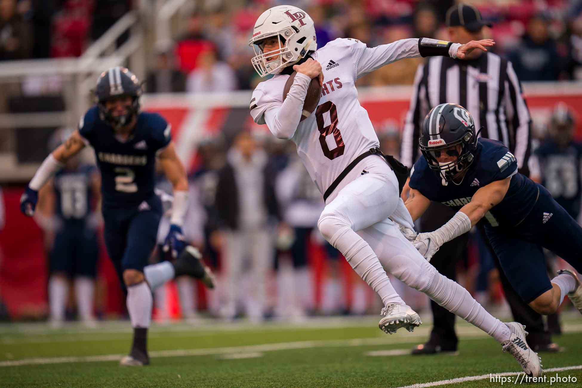 (Trent Nelson  |  The Salt Lake Tribune) Lone Peak's Easton Comer (8) runs the ball as Lone Peak faces Corner Canyon in the 6A high school football championship game in Salt Lake City on Friday, Nov. 19, 2021.