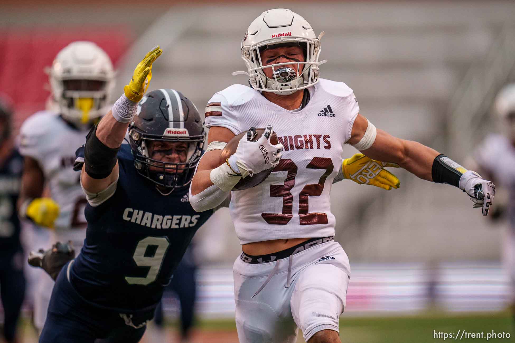 (Trent Nelson  |  The Salt Lake Tribune) Lone Peak's Tyler Bilbro (32) runs for a touchdown as Lone Peak faces Corner Canyon in the 6A high school football championship game in Salt Lake City on Friday, Nov. 19, 2021. Defending is Corner Canyon's Harrison Taggart (9).