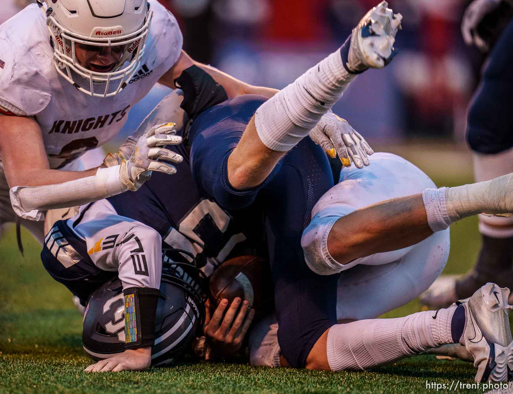 (Trent Nelson  |  The Salt Lake Tribune) Lone Peak's Connor Kelley (13) sacks Corner Canyon's Devin Brown (15) as Lone Peak faces Corner Canyon in the 6A high school football championship game in Salt Lake City on Friday, Nov. 19, 2021.