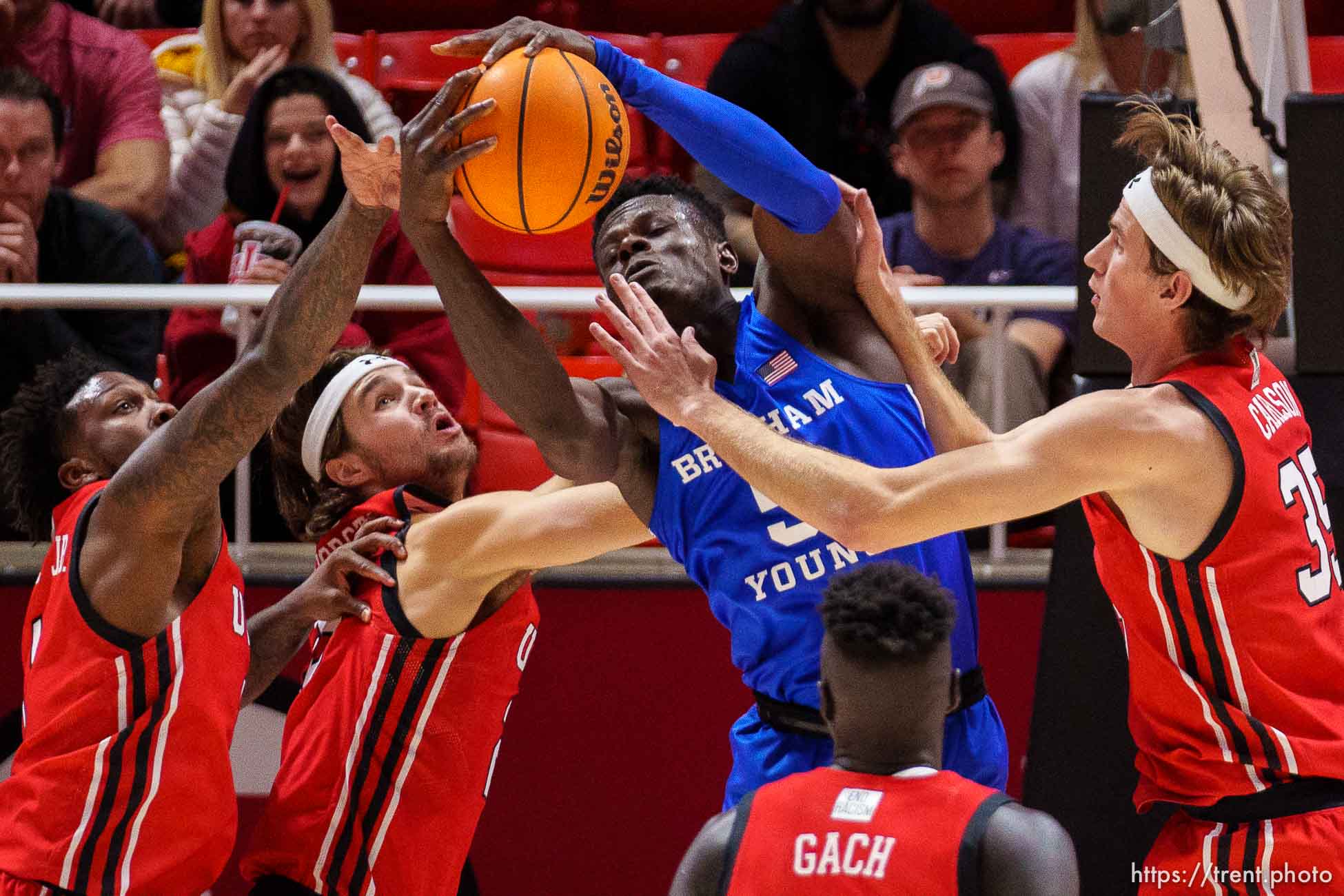 (Trent Nelson  |  The Salt Lake Tribune) Brigham Young Cougars forward Gideon George (5) rebounds as the Utah Utes host BYU, NCAA basketball in Salt Lake City on Saturday, Nov. 27, 2021.