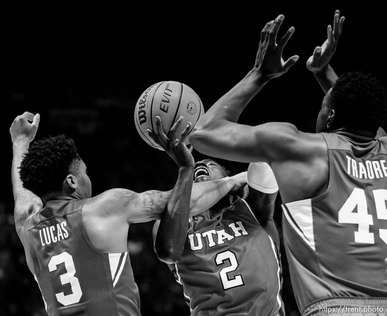 (Trent Nelson  |  The Salt Lake Tribune) Brigham Young Cougars guard Te'Jon Lucas (3) fouls Utah Utes guard Both Gach (2) as the Utah Utes host BYU, NCAA basketball in Salt Lake City on Saturday, Nov. 27, 2021.