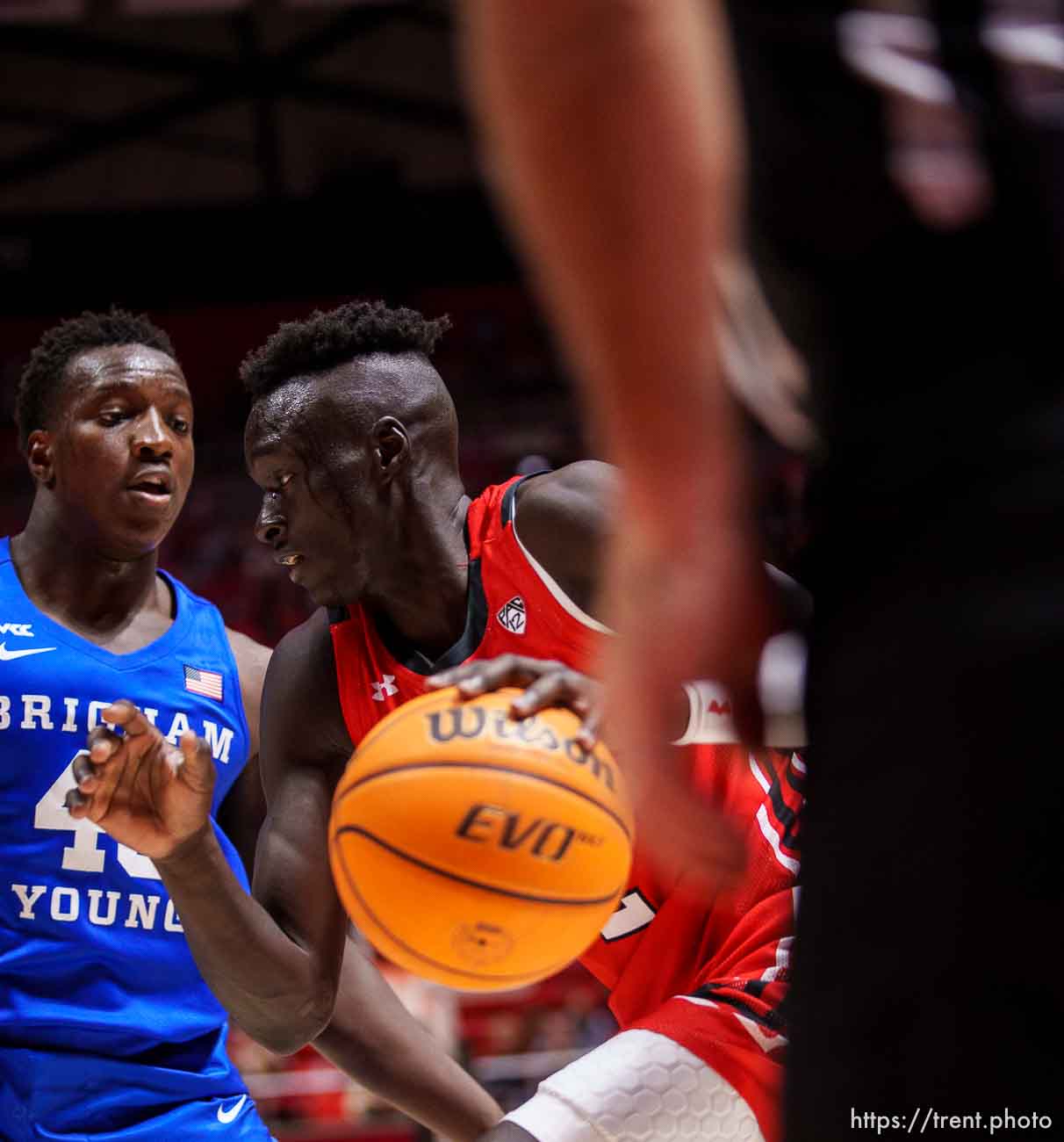 (Trent Nelson  |  The Salt Lake Tribune) Utah Utes guard Both Gach (2) drives on Brigham Young Cougars forward Fousseyni Traore (45) as the Utah Utes host BYU, NCAA basketball in Salt Lake City on Saturday, Nov. 27, 2021.