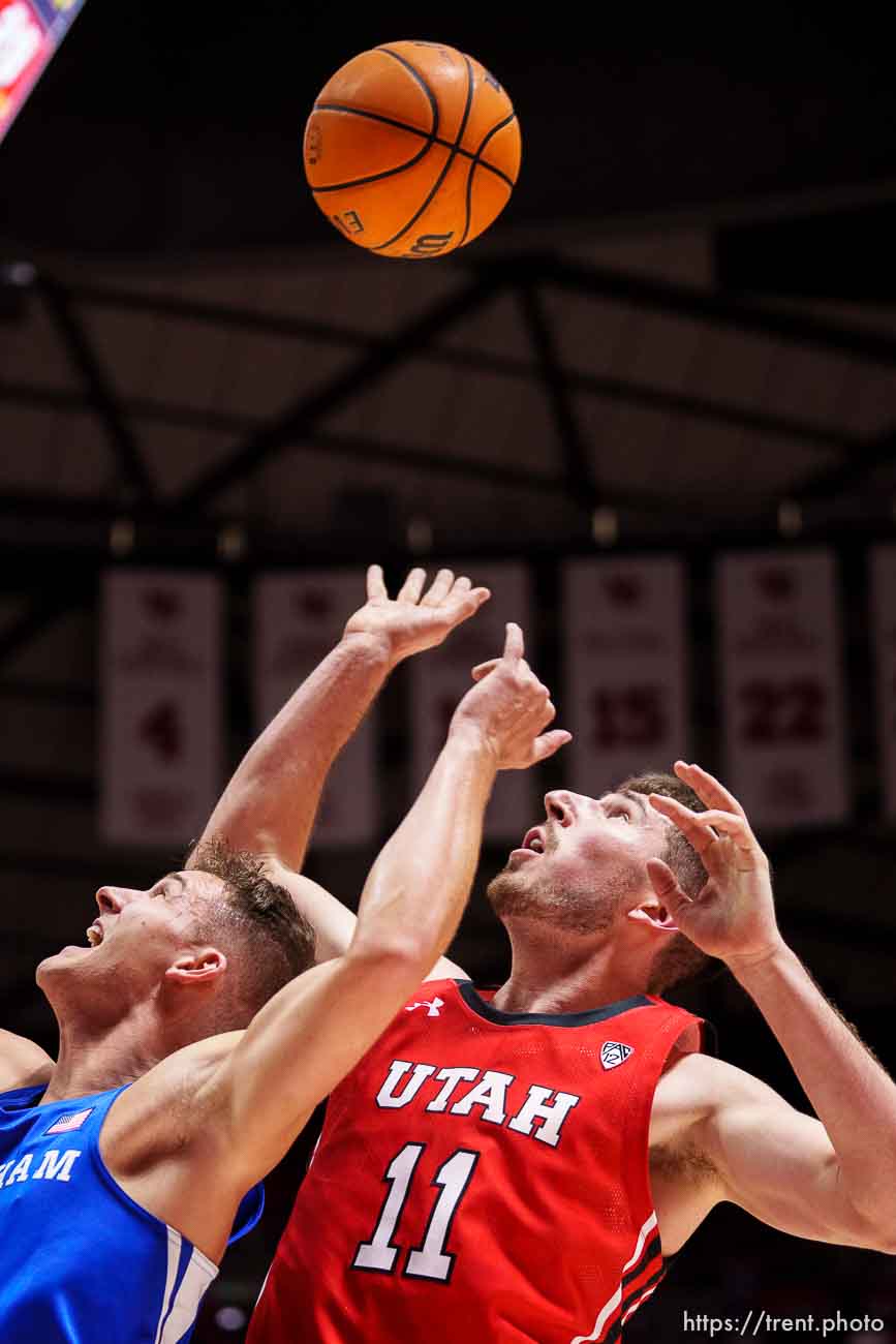 (Trent Nelson  |  The Salt Lake Tribune) Utah Utes forward Riley Battin (11) rebounds over Brigham Young Cougars guard Trevin Knell (21) as the Utah Utes host BYU, NCAA basketball in Salt Lake City on Saturday, Nov. 27, 2021.