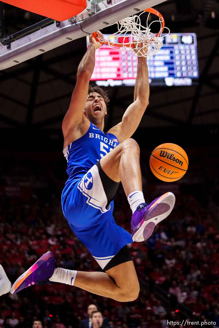 (Trent Nelson  |  The Salt Lake Tribune) Brigham Young Cougars forward Gavin Baxter (51) dunks the ball as the Utah Utes host BYU, NCAA basketball in Salt Lake City on Saturday, Nov. 27, 2021.