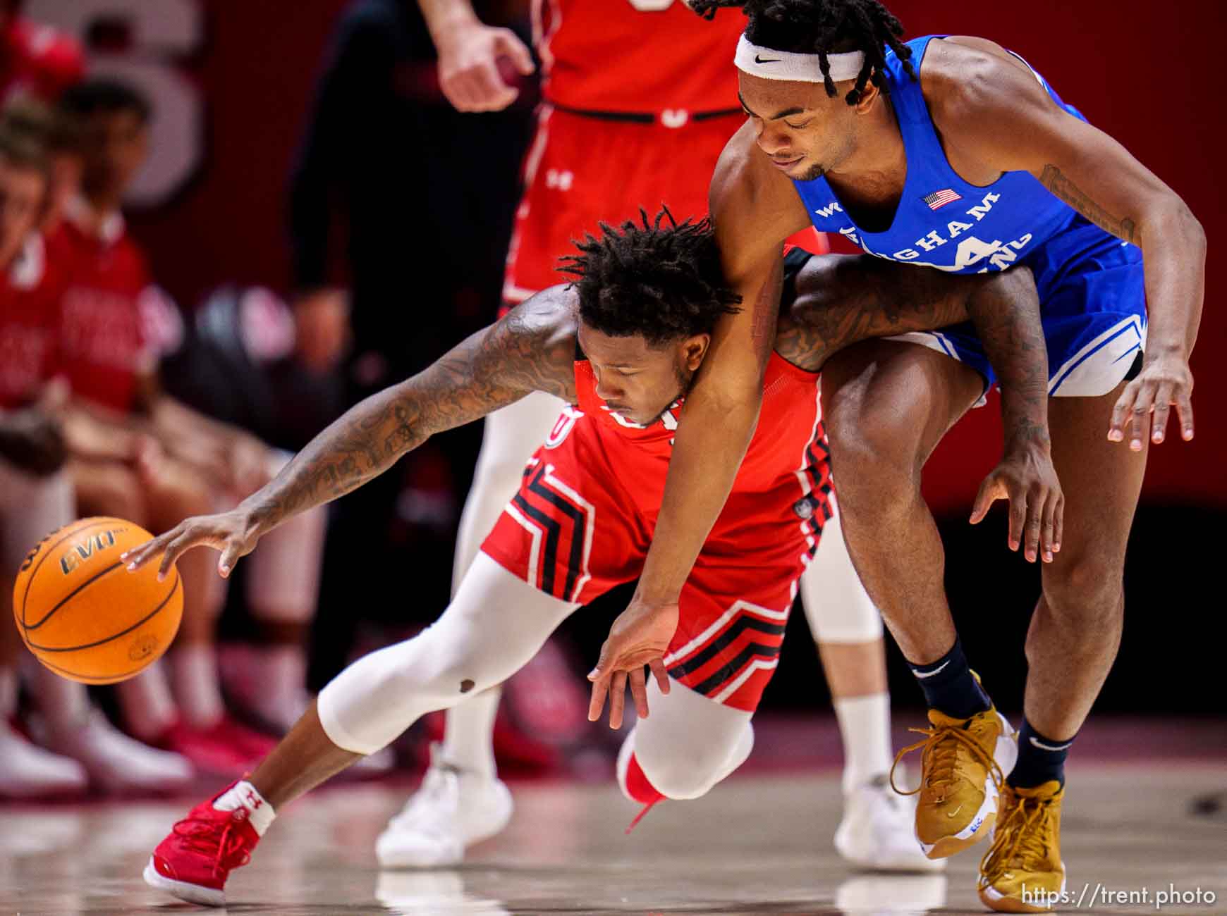 (Trent Nelson  |  The Salt Lake Tribune) Utah Utes guard David Jenkins Jr. (1) and Brigham Young Cougars forward Seneca Knight (24) scramble for a loose ball as the Utah Utes host BYU, NCAA basketball in Salt Lake City on Saturday, Nov. 27, 2021.