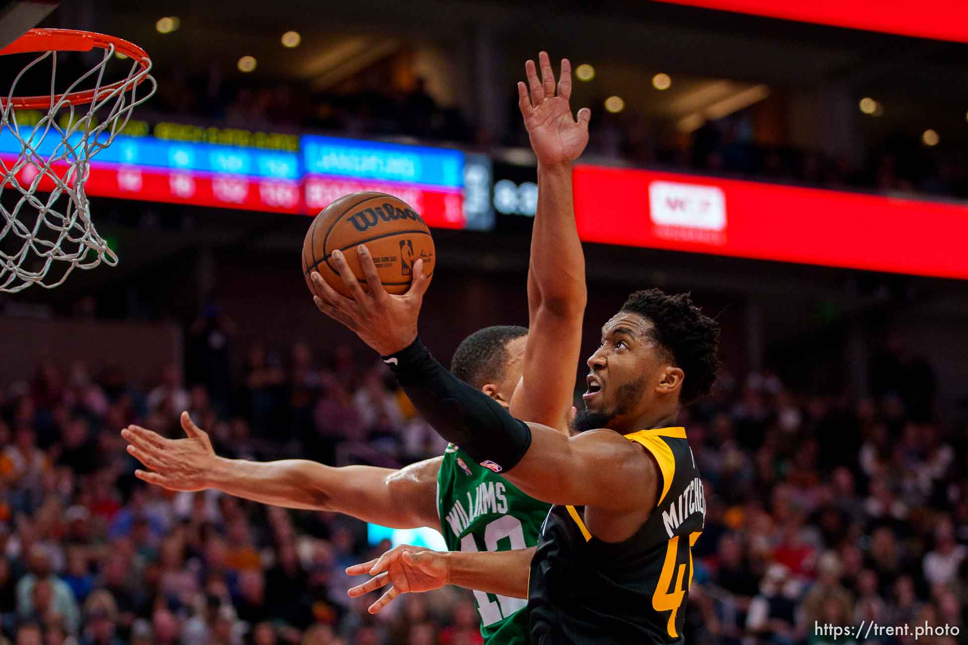 (Trent Nelson  |  The Salt Lake Tribune) Utah Jazz guard Donovan Mitchell (45) shoots, with Boston Celtics forward Grant Williams (12) defending, as the Utah Jazz host the Boston Celtics, NBA basketball in Salt Lake City on Friday, Dec. 3, 2021.