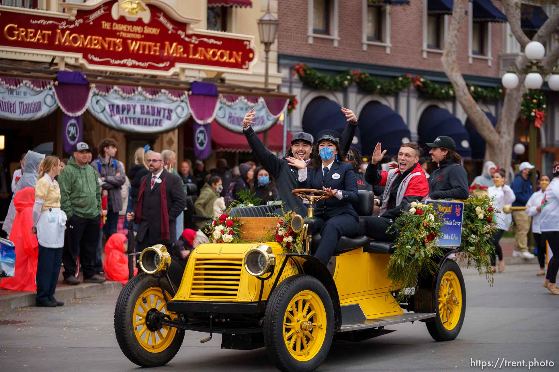 (Trent Nelson  |  The Salt Lake Tribune) Mika Tafua, Devin Lloyd, Britain Covey and Cameron Rising ride down Disneyland's Main Street during the Rose Bowl Game Cavalcade in Anaheim, Calif., on Monday, Dec. 27, 2021.