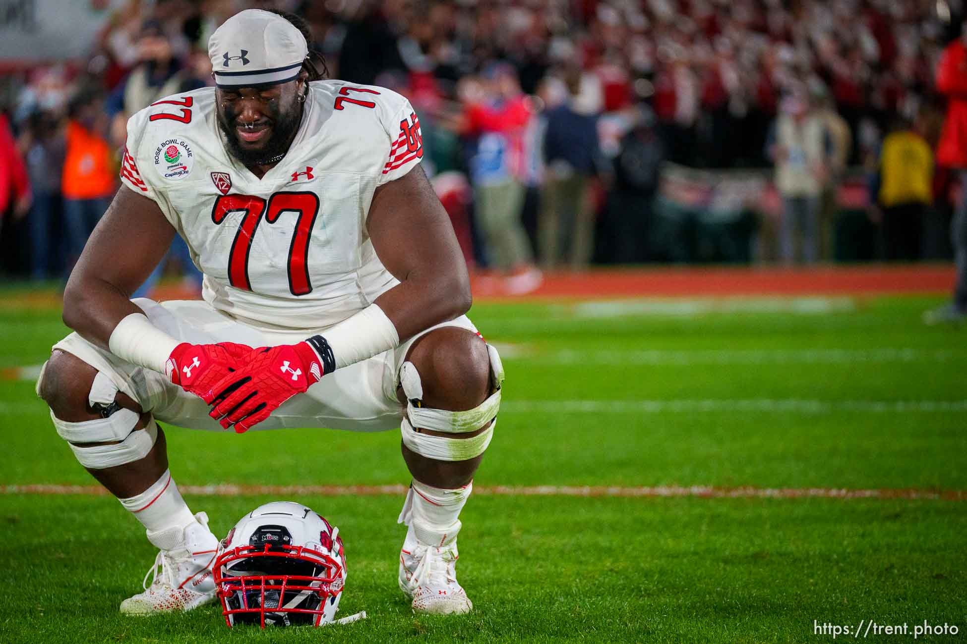 (Trent Nelson  |  The Salt Lake Tribune) Utah Utes offensive lineman Bamidele Olaseni (77) takes a moment on the field after the loss, as the Utah Utes face the Ohio State Buckeyes at the Rose Bowl in Pasadena, Calif., on Saturday, Jan. 1, 2022.