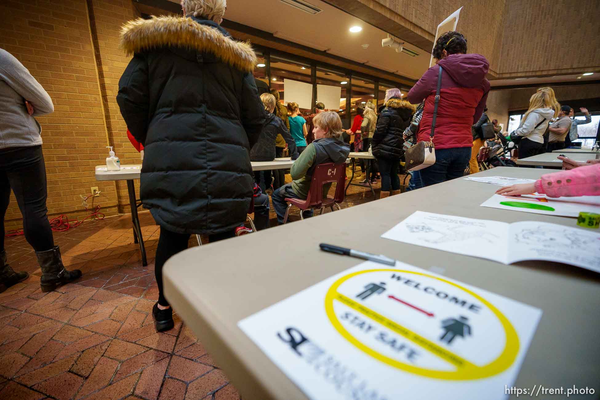 (Trent Nelson  |  The Salt Lake Tribune) People gather as the Salt Lake County Council holds a brief meeting on the mask mandate, in Salt Lake City on Thursday, Jan. 13, 2022.