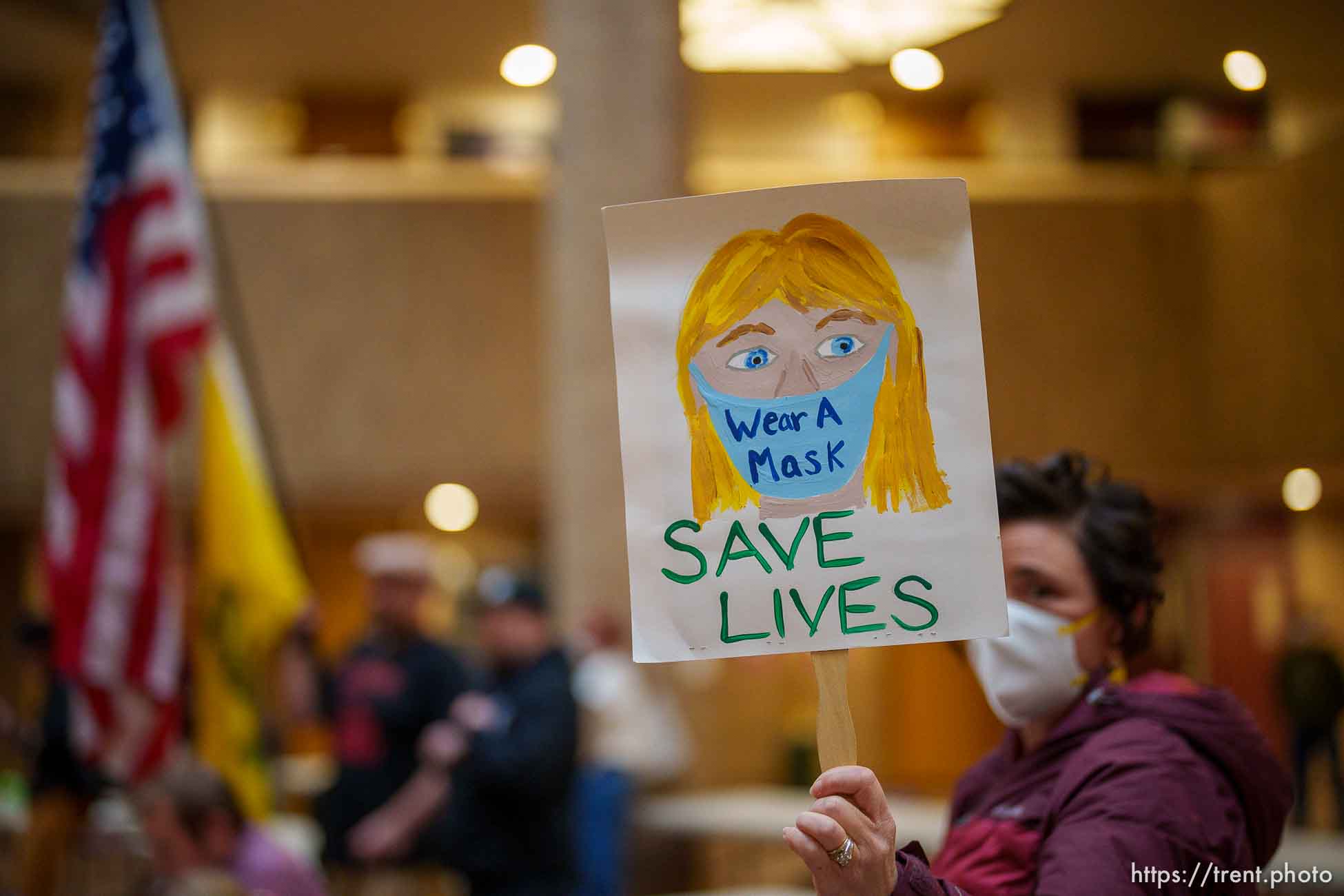 (Trent Nelson  |  The Salt Lake Tribune) People gather as the Salt Lake County Council holds a brief meeting on the mask mandate, in Salt Lake City on Thursday, Jan. 13, 2022.