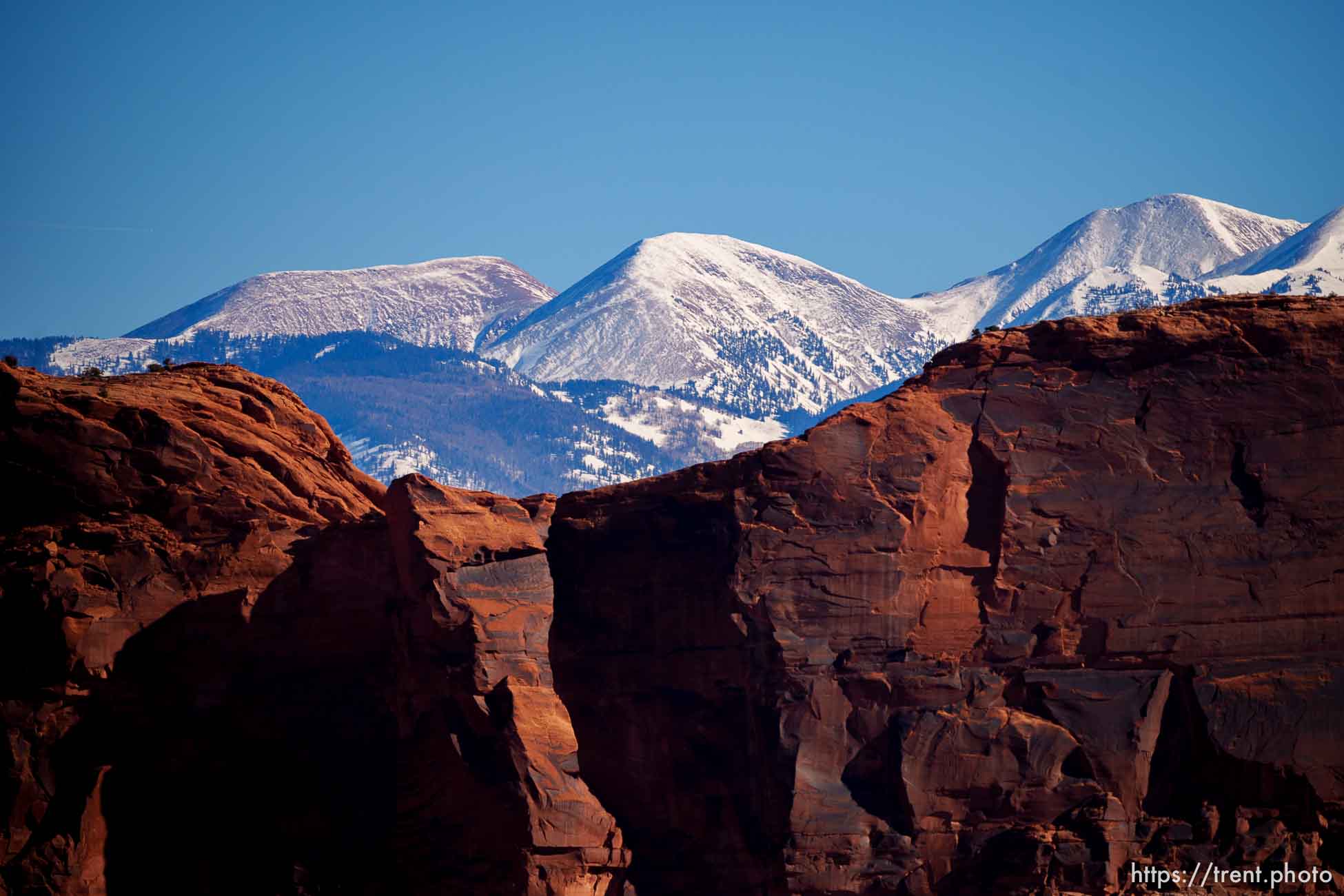 snow-covered la sal mountains la sals peaking out over red rock, from chicken corners, on Saturday, Jan. 15, 2022.