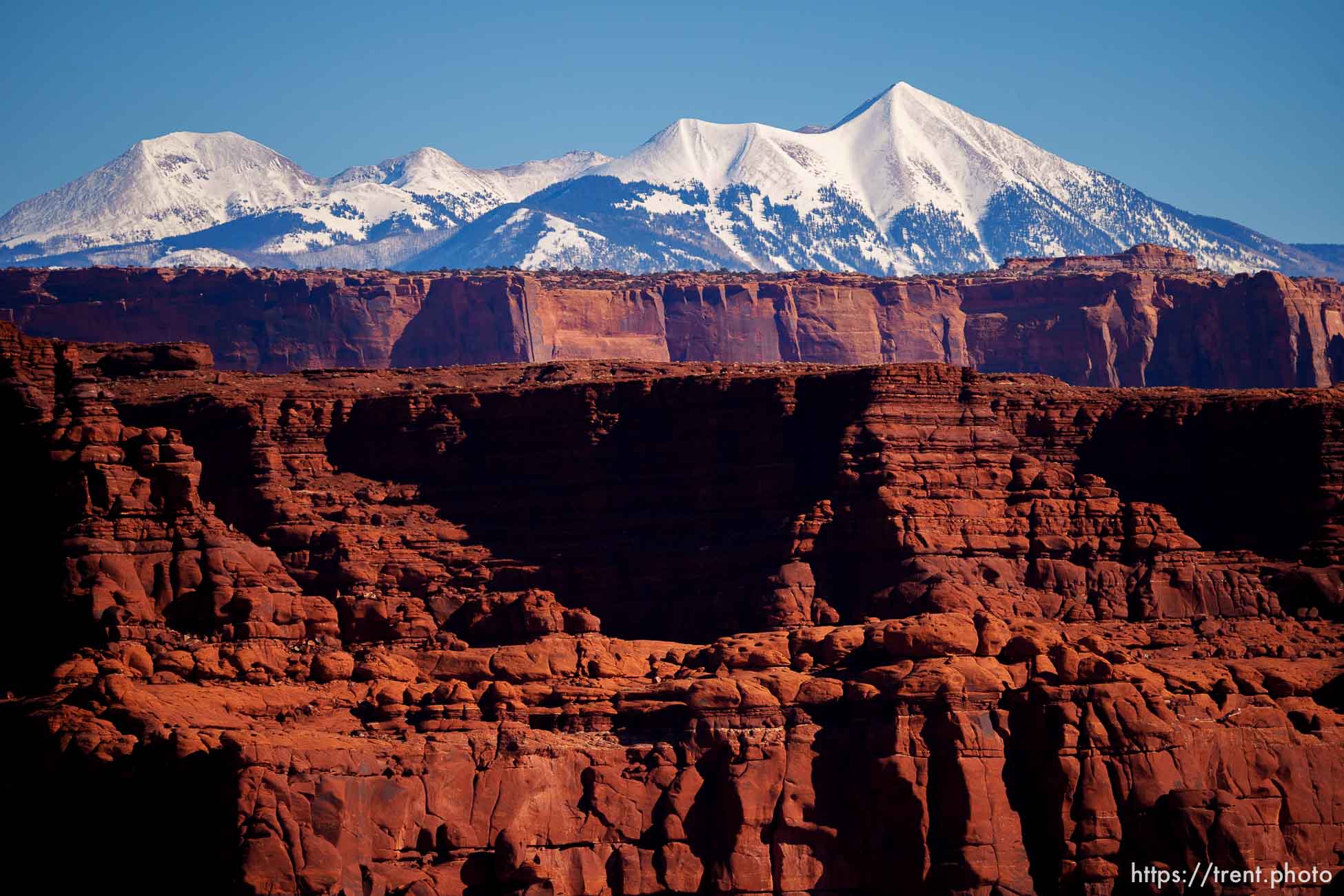 snow-covered la sal mountains la sals peaking out over red rock, from chicken corners, on Saturday, Jan. 15, 2022.