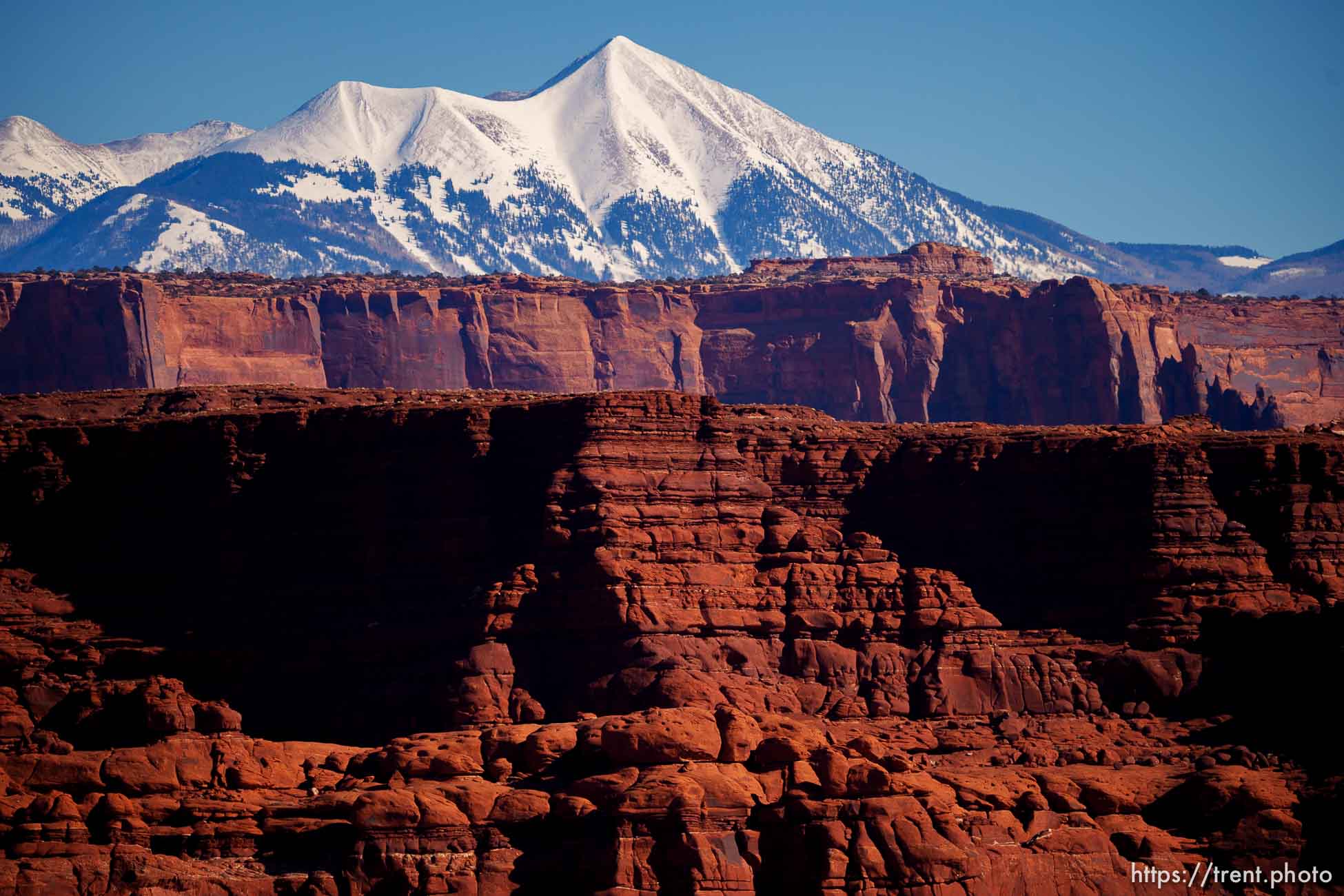 snow-covered la sal mountains la sals peaking out over red rock, from chicken corners, on Saturday, Jan. 15, 2022.