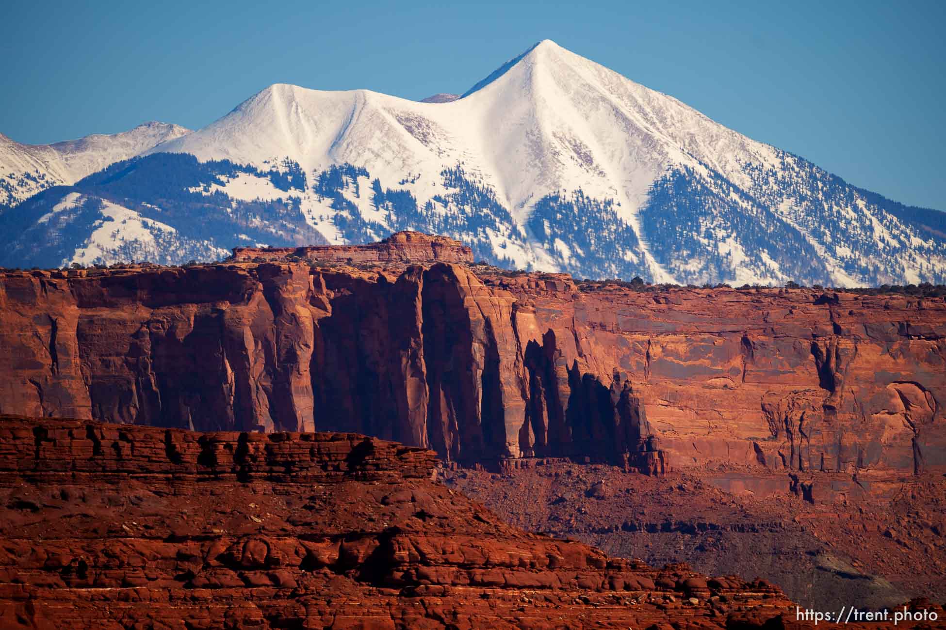 snow-covered la sal mountains la sals peaking out over red rock, from chicken corners, on Saturday, Jan. 15, 2022.