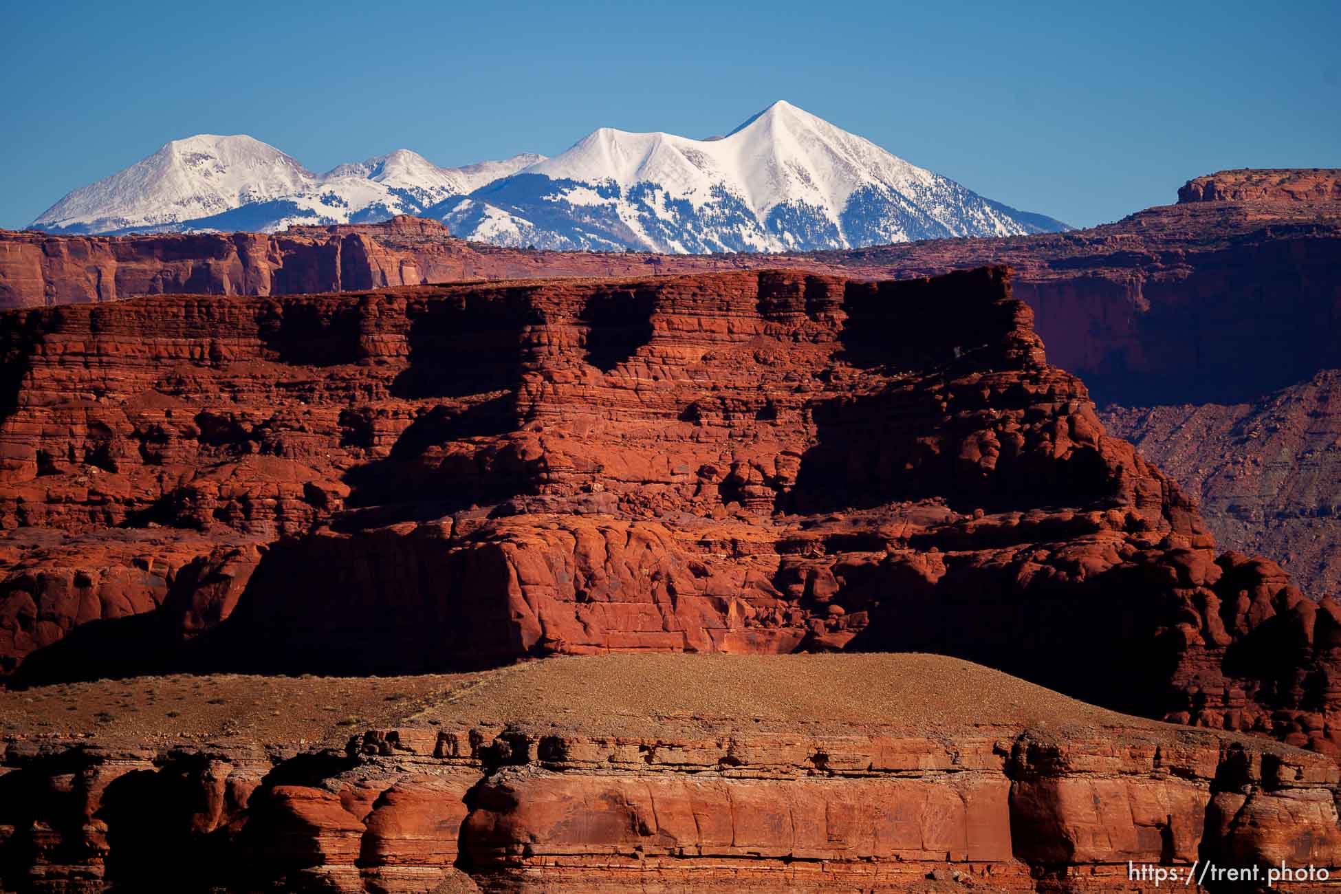 snow-covered la sal mountains la sals peaking out over red rock, from chicken corners, on Saturday, Jan. 15, 2022.