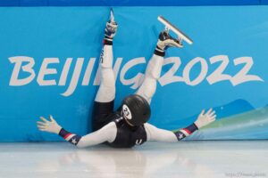 (Trent Nelson  |  The Salt Lake Tribune) Ryan Pivirotto slides into the wall during a qualifying heat for the 1000m, short track speed skating at the 2022 Winter Olympics in Beijing on Saturday, Feb. 5, 2022. After review, Pivirotto was advanced into the quarterfinals.