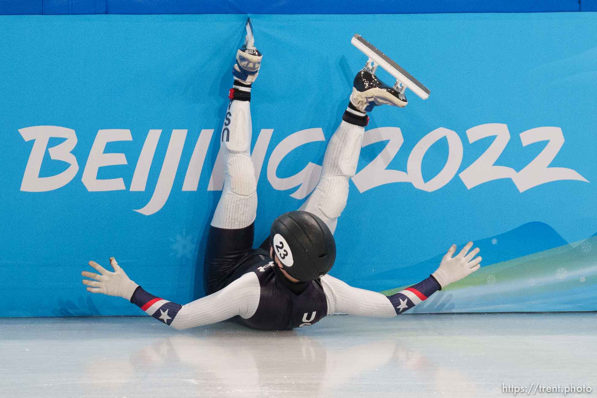 (Trent Nelson  |  The Salt Lake Tribune) Ryan Pivirotto slides into the wall during a qualifying heat for the 1000m, short track speed skating at the 2022 Winter Olympics in Beijing on Saturday, Feb. 5, 2022. After review, Pivirotto was advanced into the quarterfinals.