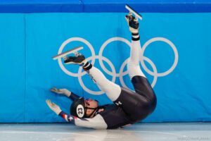 (Trent Nelson  |  The Salt Lake Tribune) Ryan Pivirotto slides into the wall during a qualifying heat for the 1000m, short track speed skating at the 2022 Winter Olympics in Beijing on Saturday, Feb. 5, 2022. After review, Pivirotto was advanced into the quarterfinals.