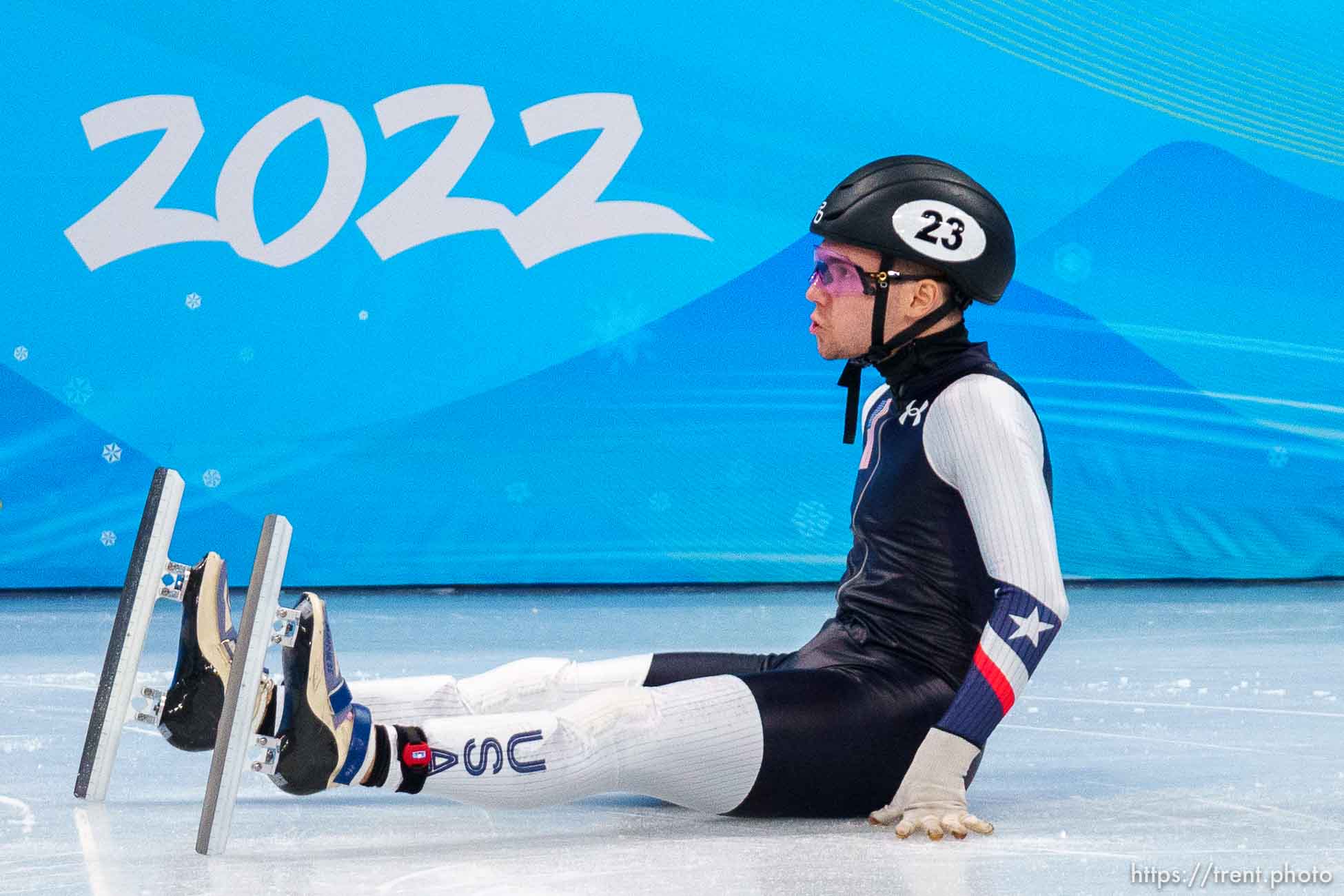 (Trent Nelson  |  The Salt Lake Tribune) Ryan Pivirotto slides into the wall during a qualifying heat for the 1000m, short track speed skating at the 2022 Winter Olympics in Beijing on Saturday, Feb. 5, 2022. After review, Pivirotto was advanced into the quarterfinals.