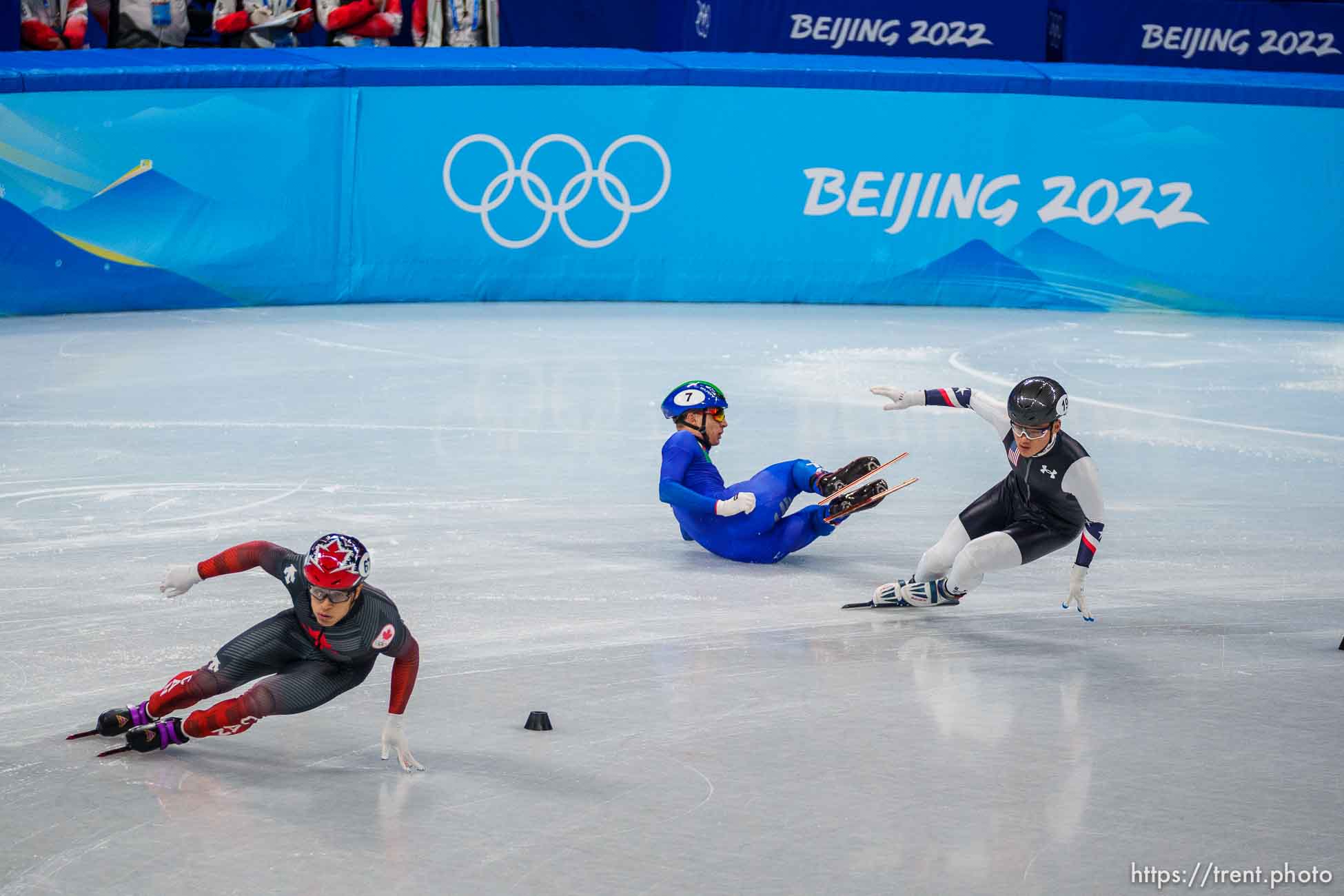 (Trent Nelson  |  The Salt Lake Tribune) Andrew Heo (USA) skates past a fallen Pietro Sighel (Italy) in the 1000m, short track speed skating at the 2022 Winter Olympics in Beijing on Monday, Feb. 7, 2022.