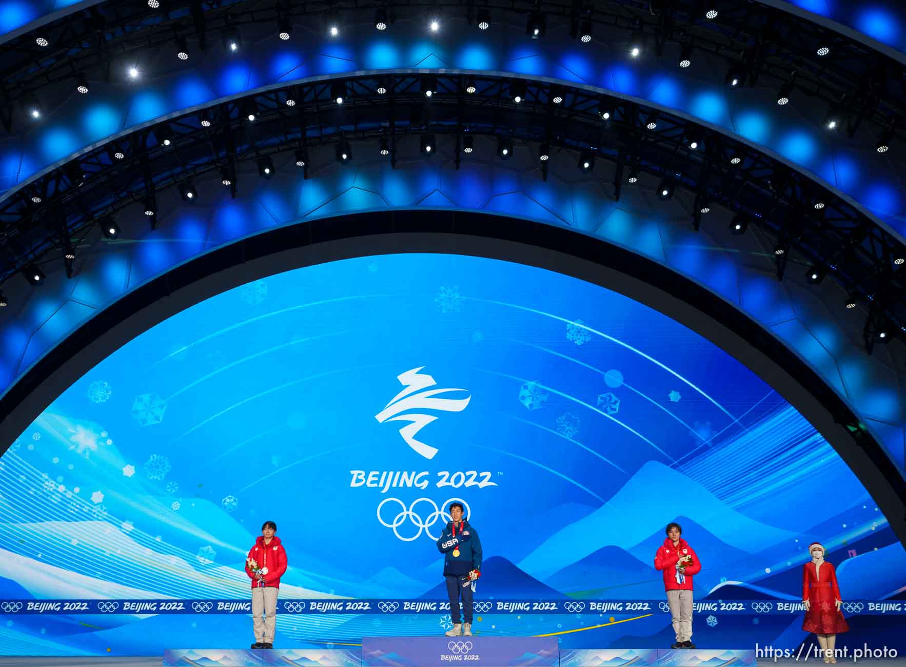 (Trent Nelson  |  The Salt Lake Tribune) Nathan Chen receives his gold medal for men single figure skating at the Beijing Medals Plaza during the 2022 Winter Olympics on Thursday, Feb. 10, 2022. At left is silver medalist Yuma Kagiyama (Japan) and at right is bronze medalist Shoma Uno (Japan).