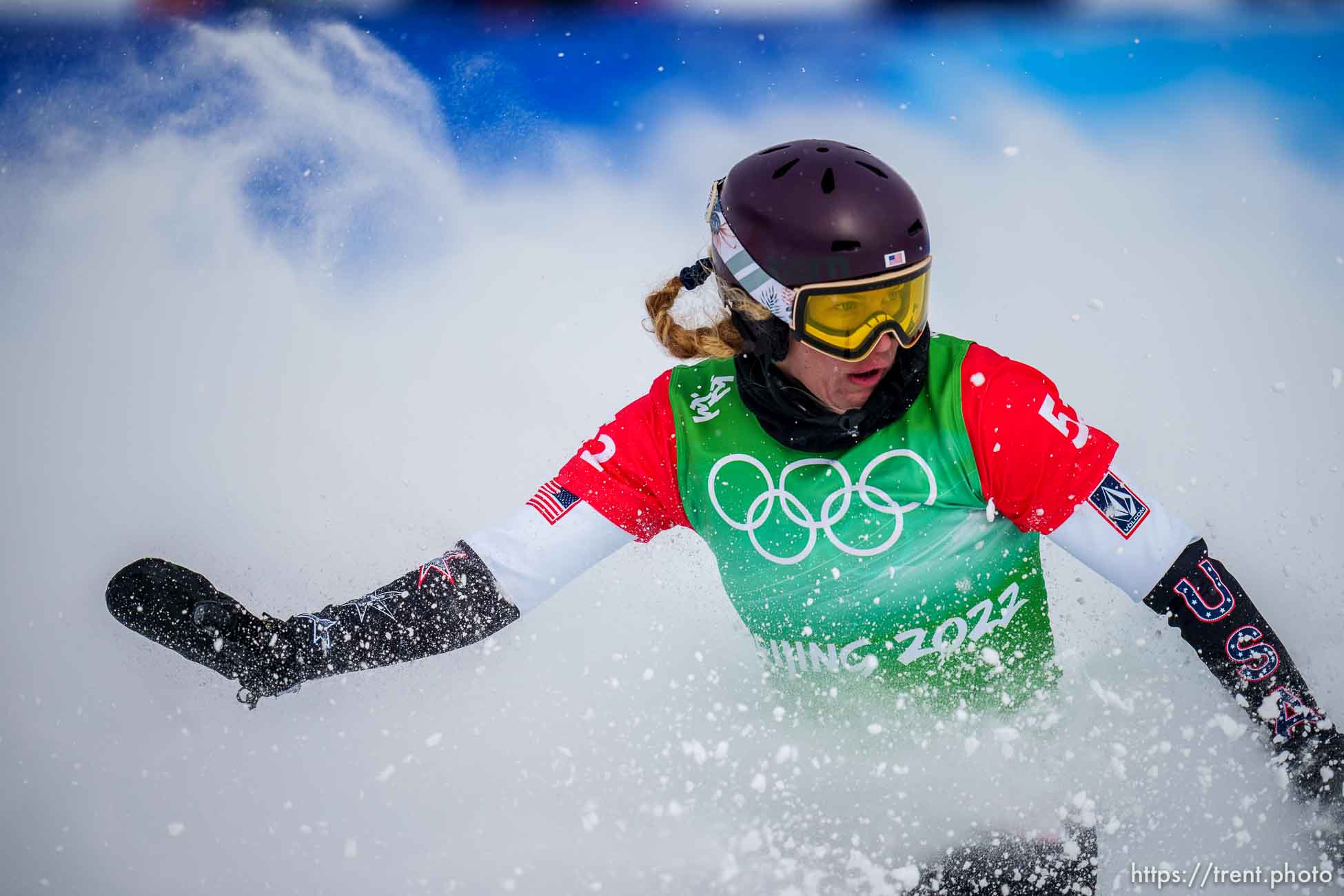 (Trent Nelson  |  The Salt Lake Tribune) Lindsey Jacobellis slides into the finish, winning the gold medal at mixed team snowboard cross at the 2022 Beijing Winter Olympics in Zhangjiakou on Saturday, Feb. 12, 2022.