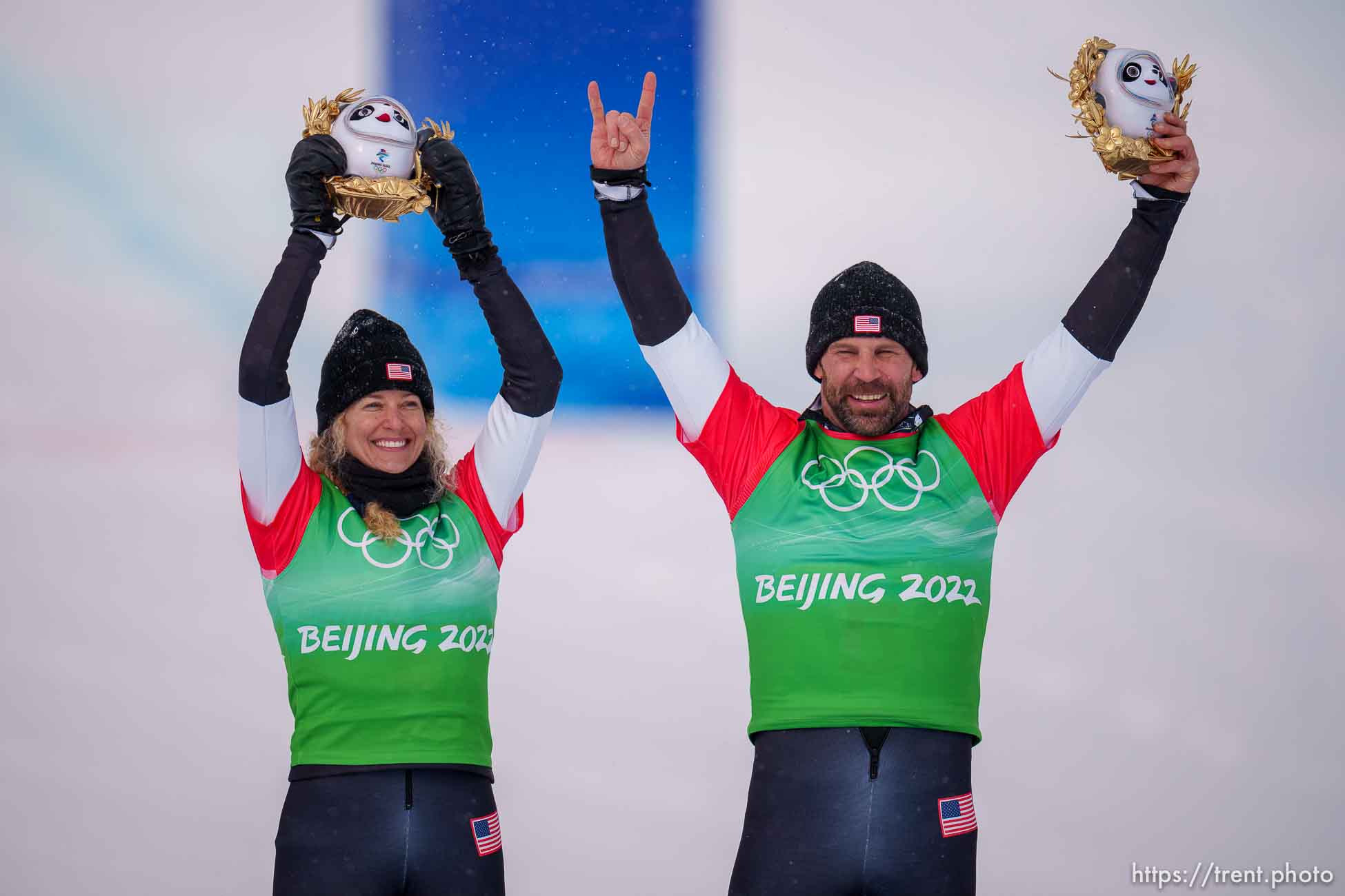 (Trent Nelson  |  The Salt Lake Tribune) Lindsey Jacobellis and Nick Baumgartner (USA) celebrate their gold medal win at mixed team snowboard cross at the 2022 Beijing Winter Olympics in Zhangjiakou on Saturday, Feb. 12, 2022.