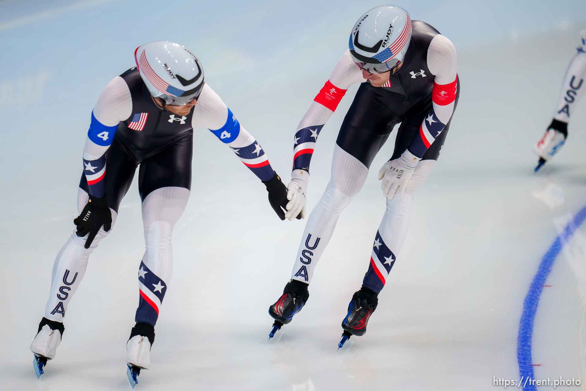 (Trent Nelson  |  The Salt Lake Tribune) Joey Mantia reaches out to Casey Dawson as Team USA wins the bronze medal in men's team pursuit, speed skating at the 2022 Winter Olympics in Beijing on Tuesday, Feb. 15, 2022.