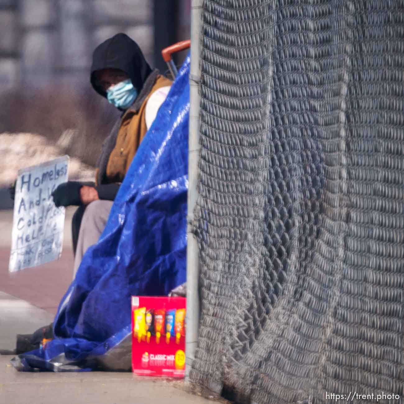 man with sign on Thursday, March 10, 2022.