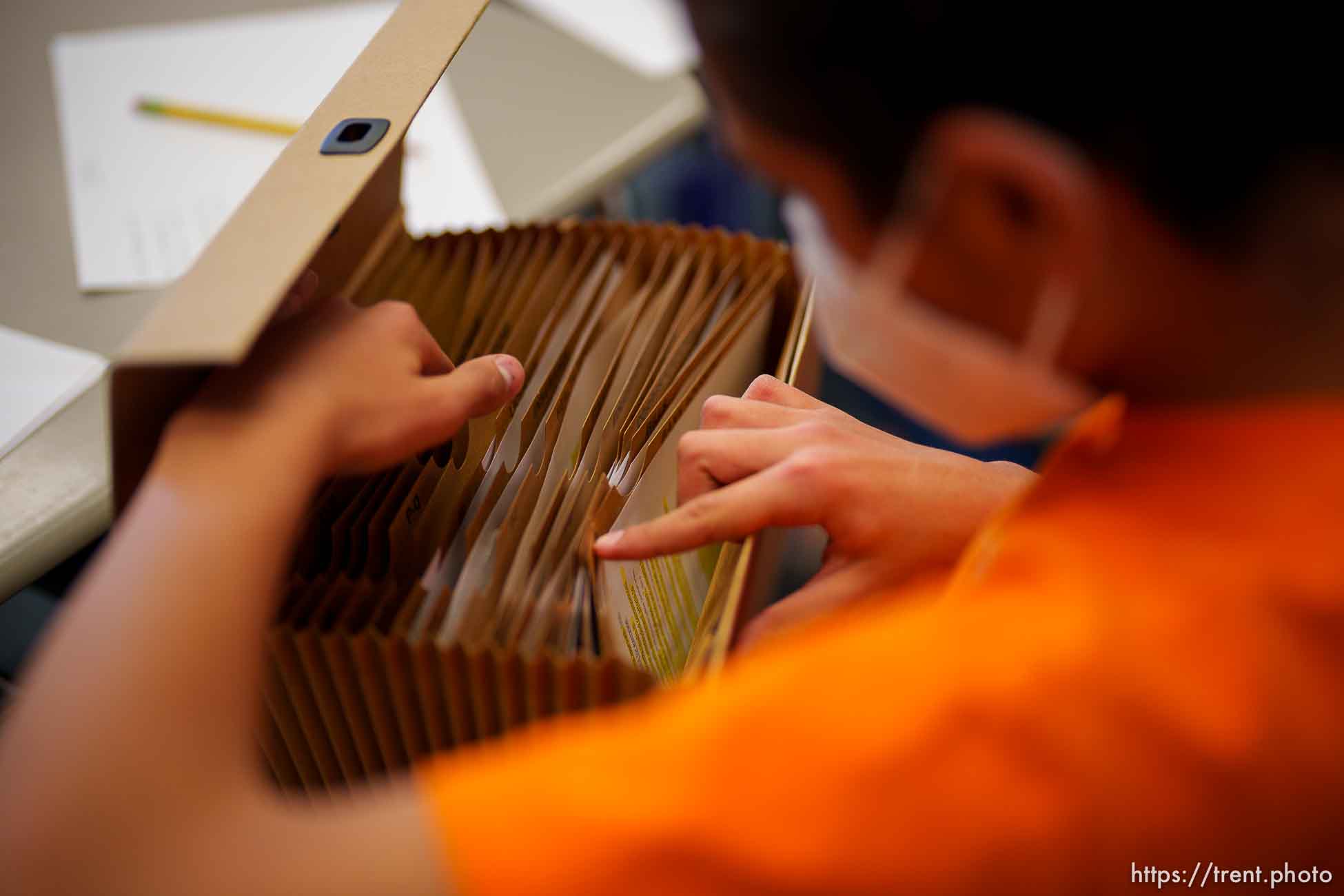 (Trent Nelson  |  The Salt Lake Tribune) Lucas Lamas looks through notes during debate practice at Rowland Hall school in Salt Lake City on Thursday, March 10, 2022.