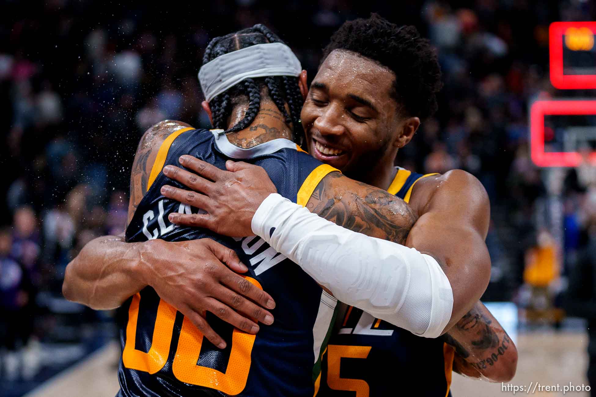 (Trent Nelson  |  The Salt Lake Tribune) Utah Jazz guard Jordan Clarkson (00) embraces Utah Jazz guard Donovan Mitchell (45) as the Utah Jazz host the Sacramento Kings, NBA basketball in Salt Lake City on Saturday, March 12, 2022. Clarkson finished with a career-high 45 points.