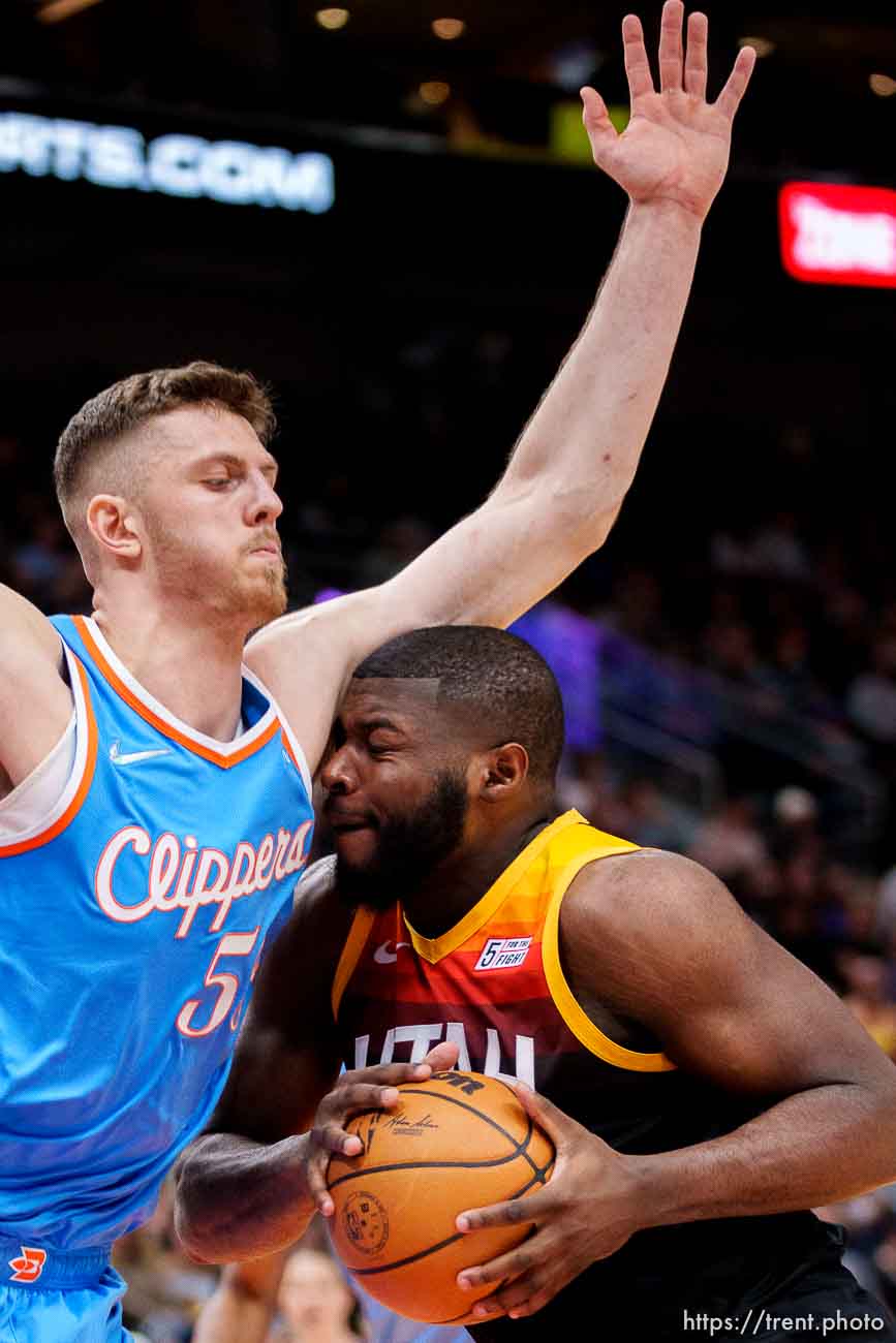 (Trent Nelson  |  The Salt Lake Tribune) Utah Jazz forward Eric Paschall (0) defended by LA Clippers center Isaiah Hartenstein (55) as the Utah Jazz host the Los Angeles Clippers, NBA basketball in Salt Lake City on Friday, March 18, 2022.