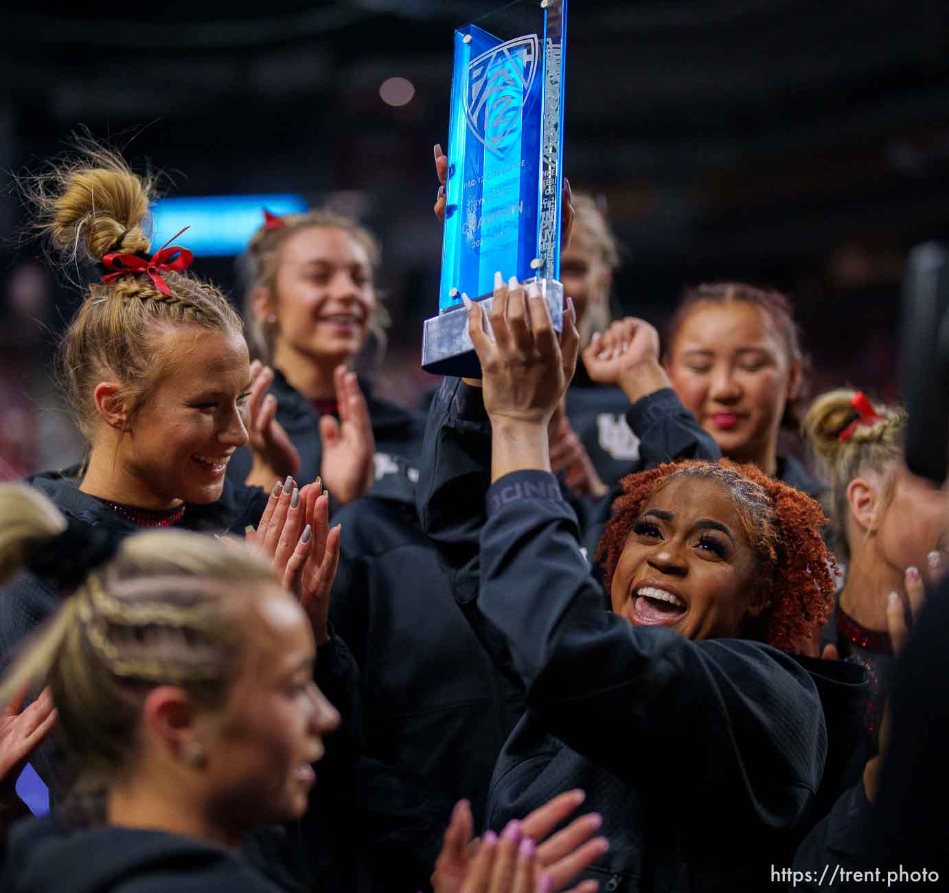 (Trent Nelson  |  The Salt Lake Tribune) Utah celebrates with the Pac-12 championship trophy at the Pac-12 gymnastics championships at the Maverik Center in West Valley City on Saturday, March 19, 2022.