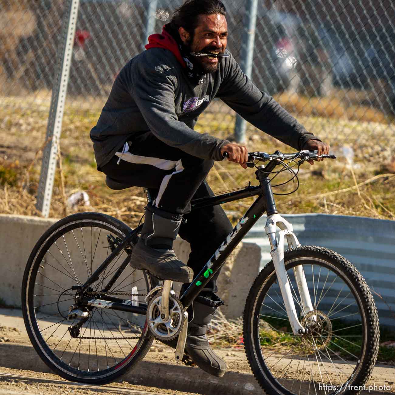 guy riding bike down 1700 south with a knife on Thursday, March 17, 2022.